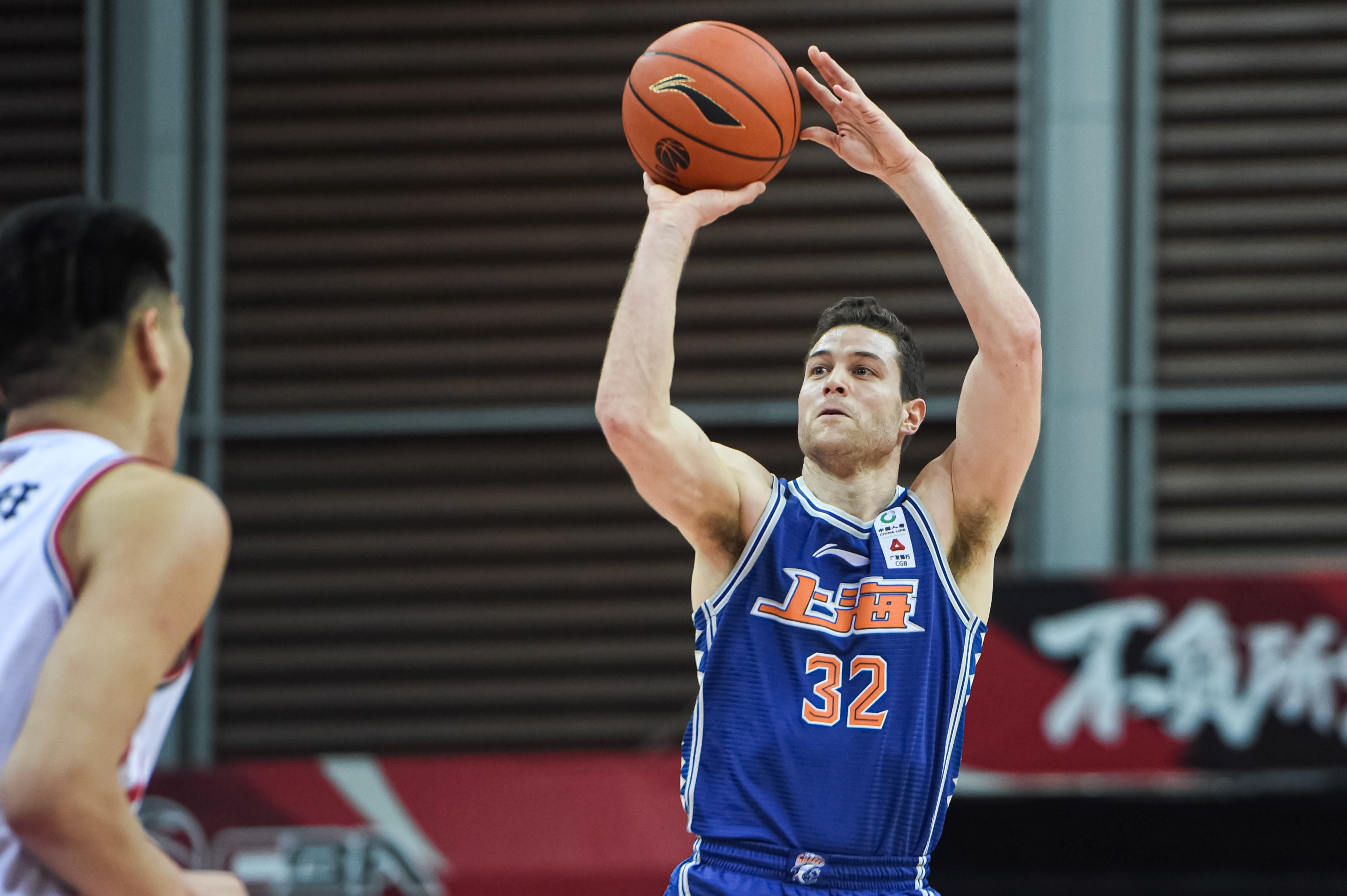 ZHUJI, March 10, 2021 -- Jimmer Fredette R of Shanghai Sharks shoots during the 44th round match between Qingdao Eagles and Shanghai Sharks at the 2020-2021 season of the Chinese Basketball Association CBA league in Zhuji, east China's Zhejiang Province, March 10, 2021. (Photo by Jiang Han/Xinhua via Getty) (Xinhua/Jiang Han via Getty Images)