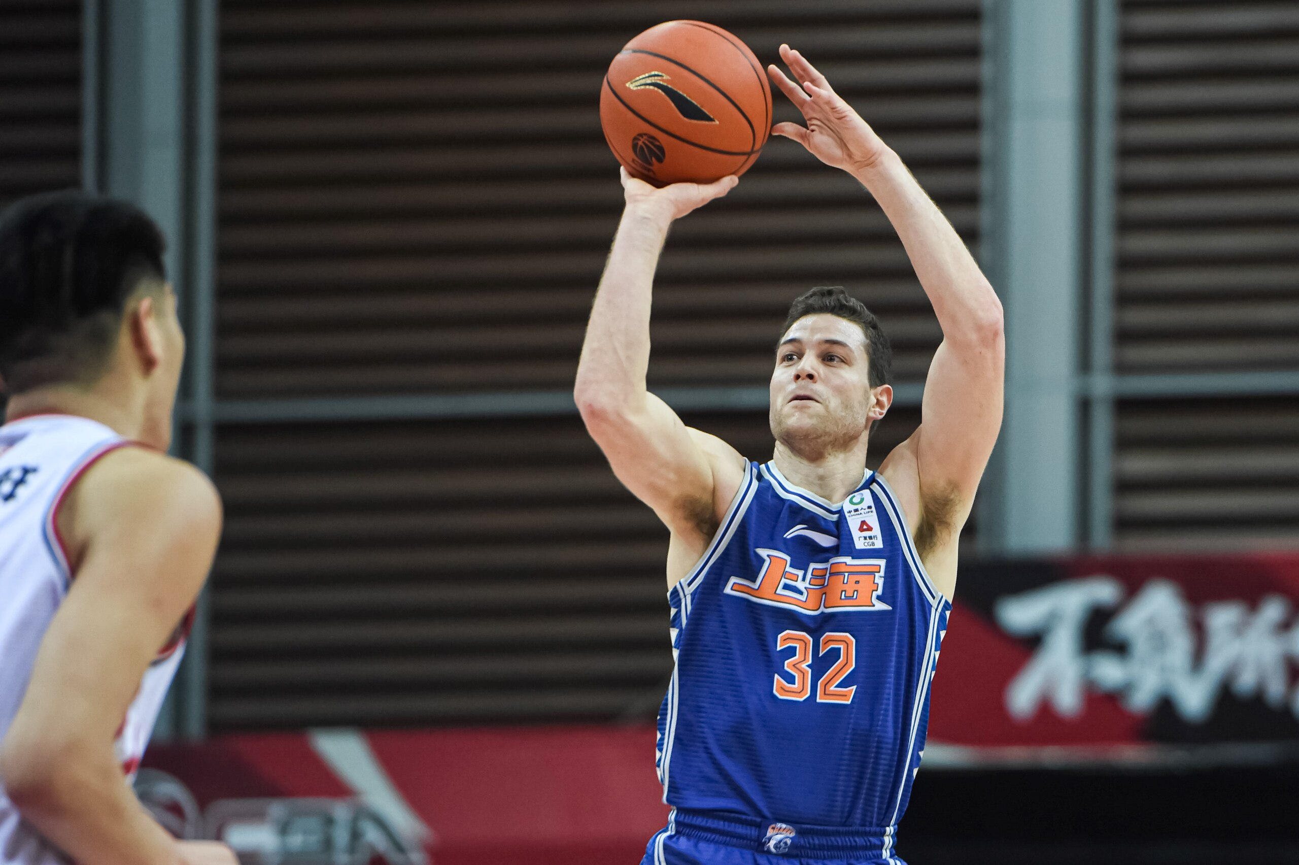 ZHUJI, March 10, 2021 -- Jimmer Fredette R of Shanghai Sharks shoots during the 44th round match between Qingdao Eagles and Shanghai Sharks at the 2020-2021 season of the Chinese Basketball Association CBA league in Zhuji, east China's Zhejiang Province, March 10, 2021. (Photo by Jiang Han/Xinhua via Getty) (Xinhua/Jiang Han via Getty Images)