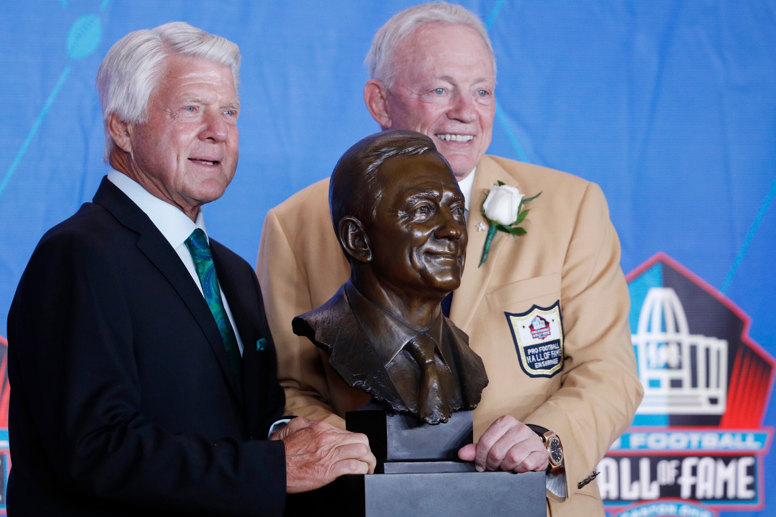 CANTON, OH - AUGUST 05: Dallas Cowboys owner Jerry Jones and presenter Jimmie Johnson pose with Jones' bust during the Pro Football Hall of Fame Enshrinement Ceremony at Tom Benson Hall of Fame Stadium on August 5, 2017 in Canton, Ohio. (Photo by Joe Robbins/Getty Images)