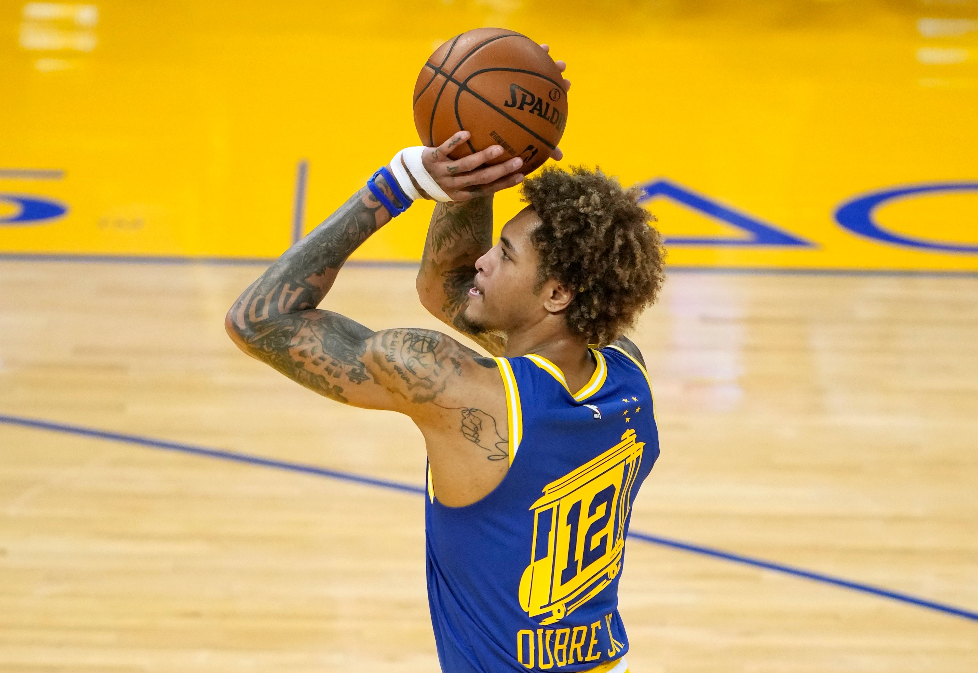 SAN FRANCISCO, CALIFORNIA - APRIL 27: Kelly Oubre Jr. #12 of the Golden State Warriors stands at the line to shoot a foul shot against the Dallas Mavericks during the first half of an NBA basketball game at Chase Center on April 27, 2021 in San Francisco, California. NOTE TO USER: User expressly acknowledges and agrees that, by downloading and or using this photograph, User is consenting to the terms and conditions of the Getty Images License Agreement. (Photo by Thearon W. Henderson/Getty Images)
