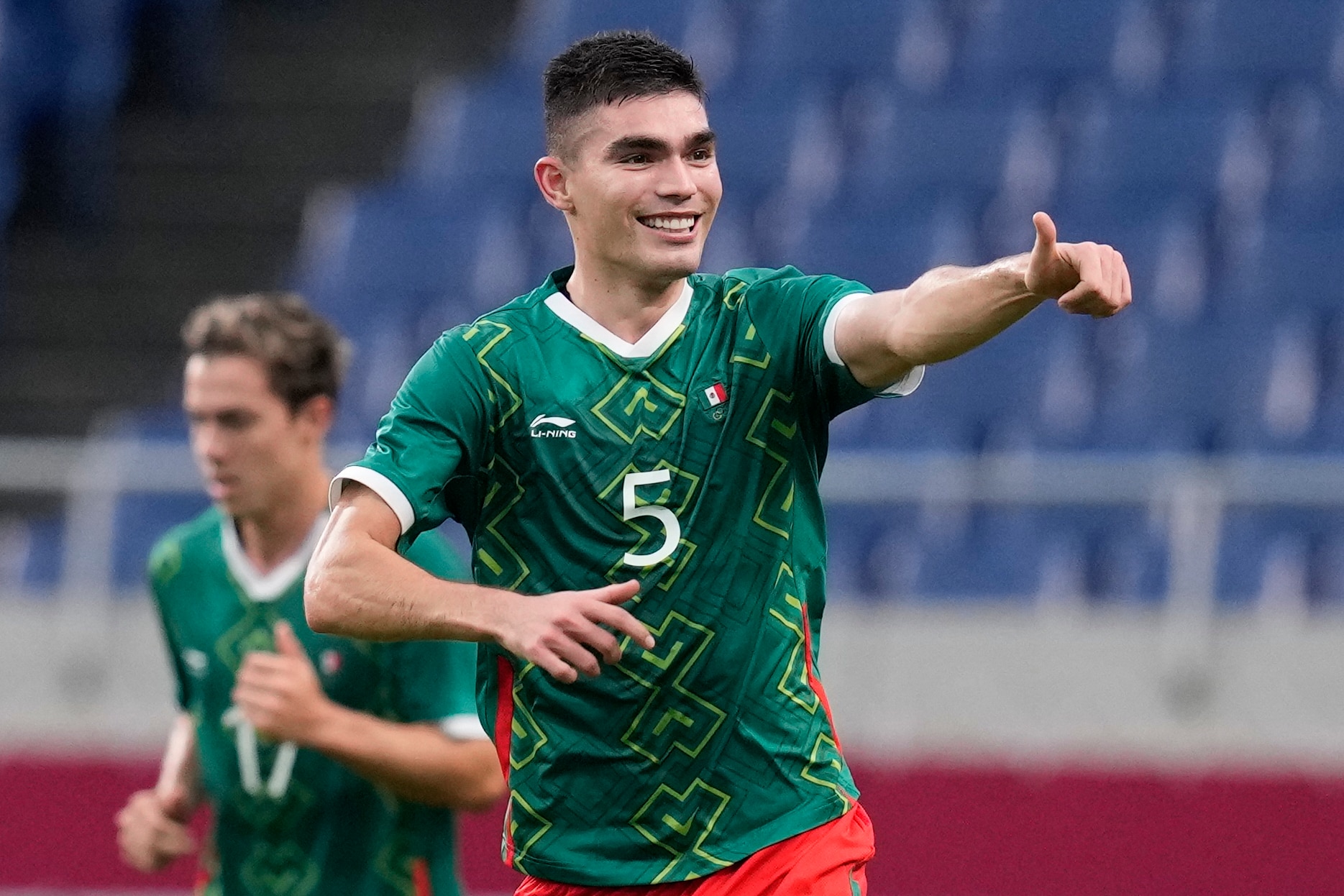 Mexico's Johan Vasquez celebrates scoring his side's second goal against Japan in the men's bronze medal soccer match at the 2020 Summer Olympics, Friday, Aug. 6, 2021, in Saitama, Japan. (AP Photo/Martin Mejia)