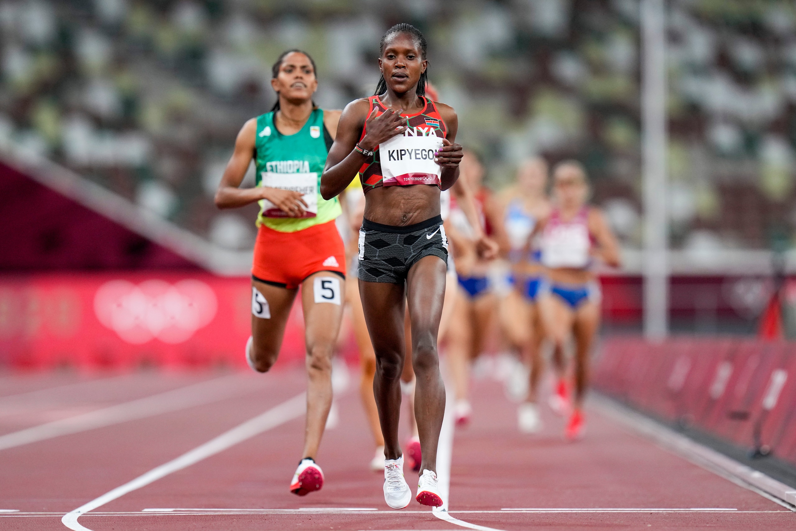 Faith Kipyegon, of Kenya, wins a women's 1,500-meter semifinal at the 2020 Summer Olympics, Wednesday, Aug. 4, 2021, in Tokyo. (AP Photo/Petr David Josek)