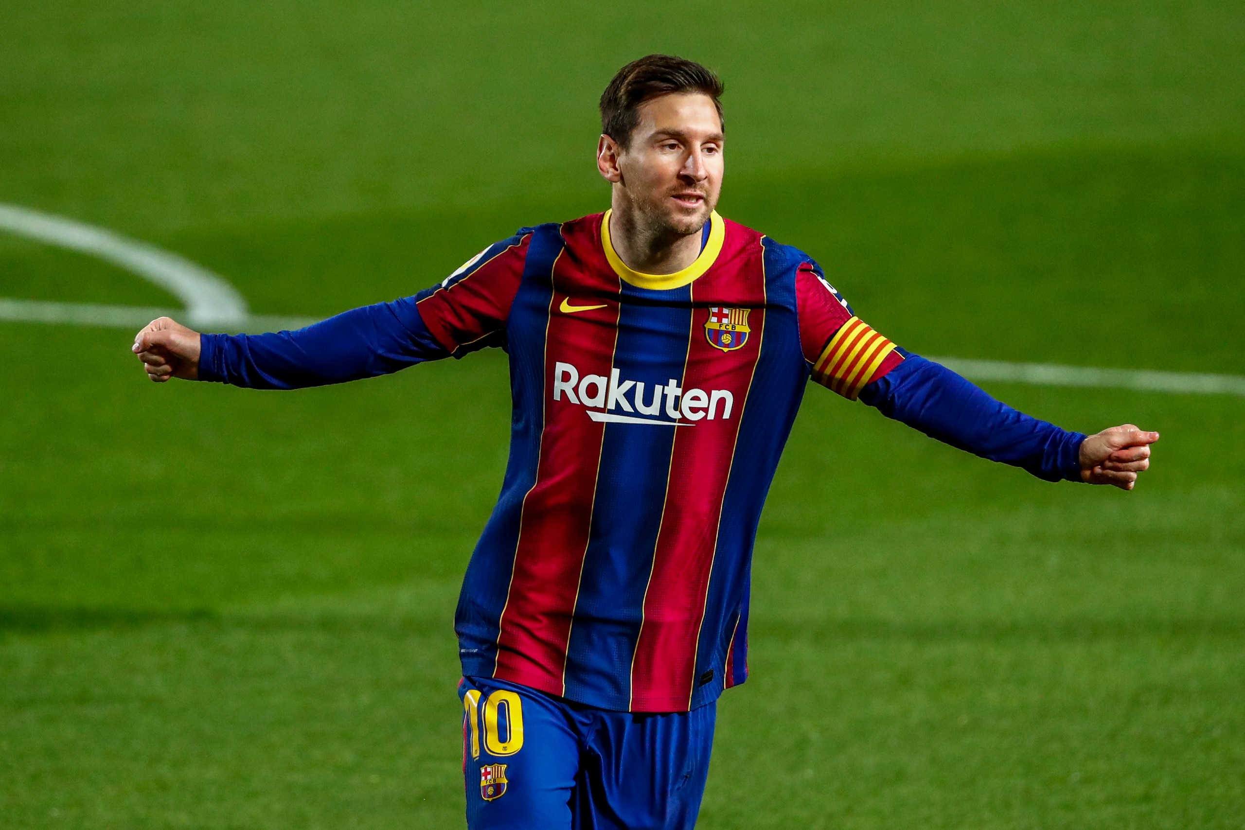 Barcelona's Lionel Messi celebrates after scoring the opening goal during the Spanish La Liga soccer match between FC Barcelona and Getafe at the Camp Nou stadium in Barcelona, Spain, Thursday, April 22, 2021. (AP Photo/Joan Monfort)