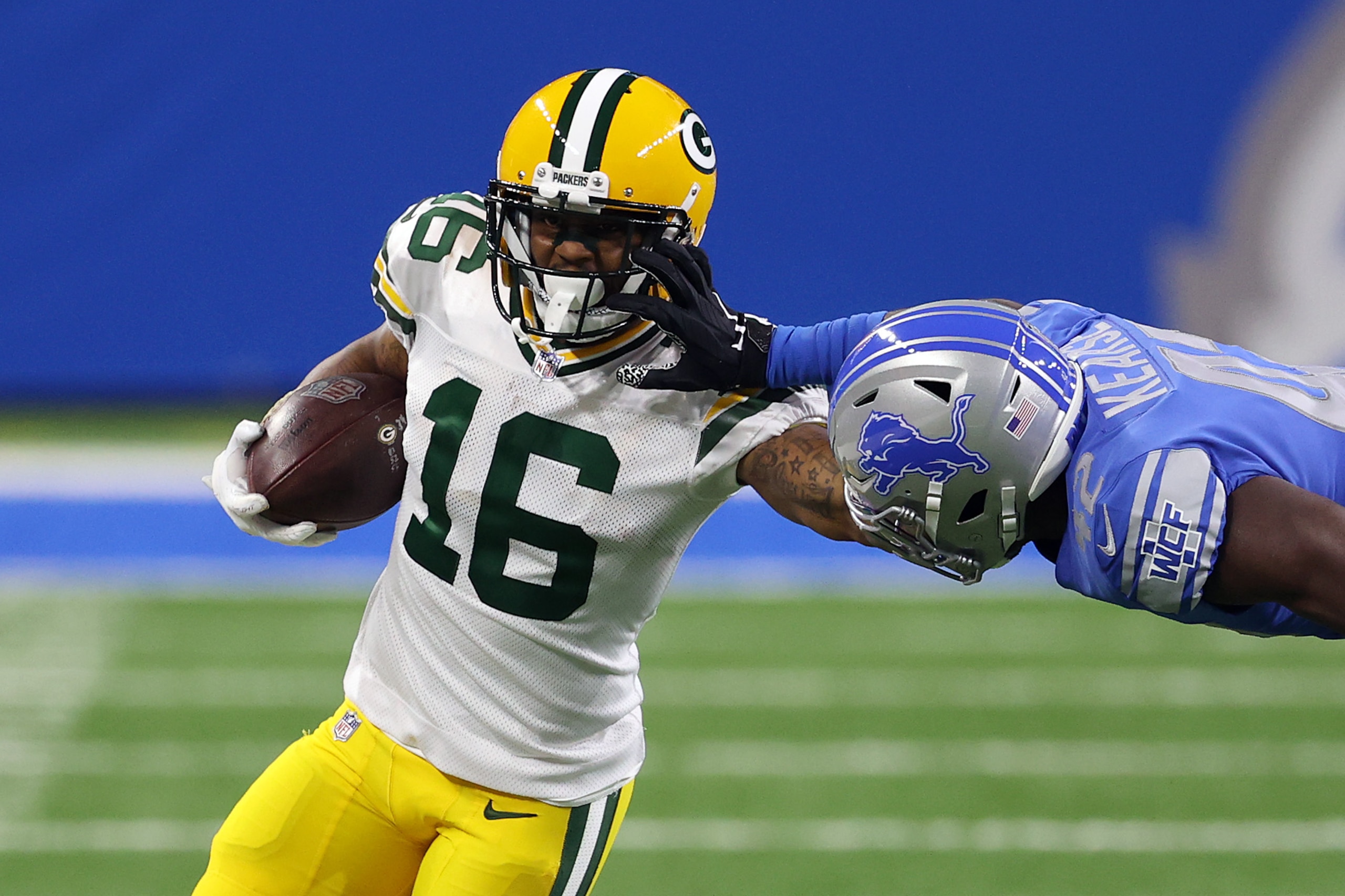 DETROIT, MICHIGAN - DECEMBER 13: Tavon Austin #16 of the Green Bay Packers is forced out of bounds by Jayron Kearse #42 of the Detroit Lions during the first half at Ford Field on December 13, 2020 in Detroit, Michigan. (Photo by Gregory Shamus/Getty Images)
