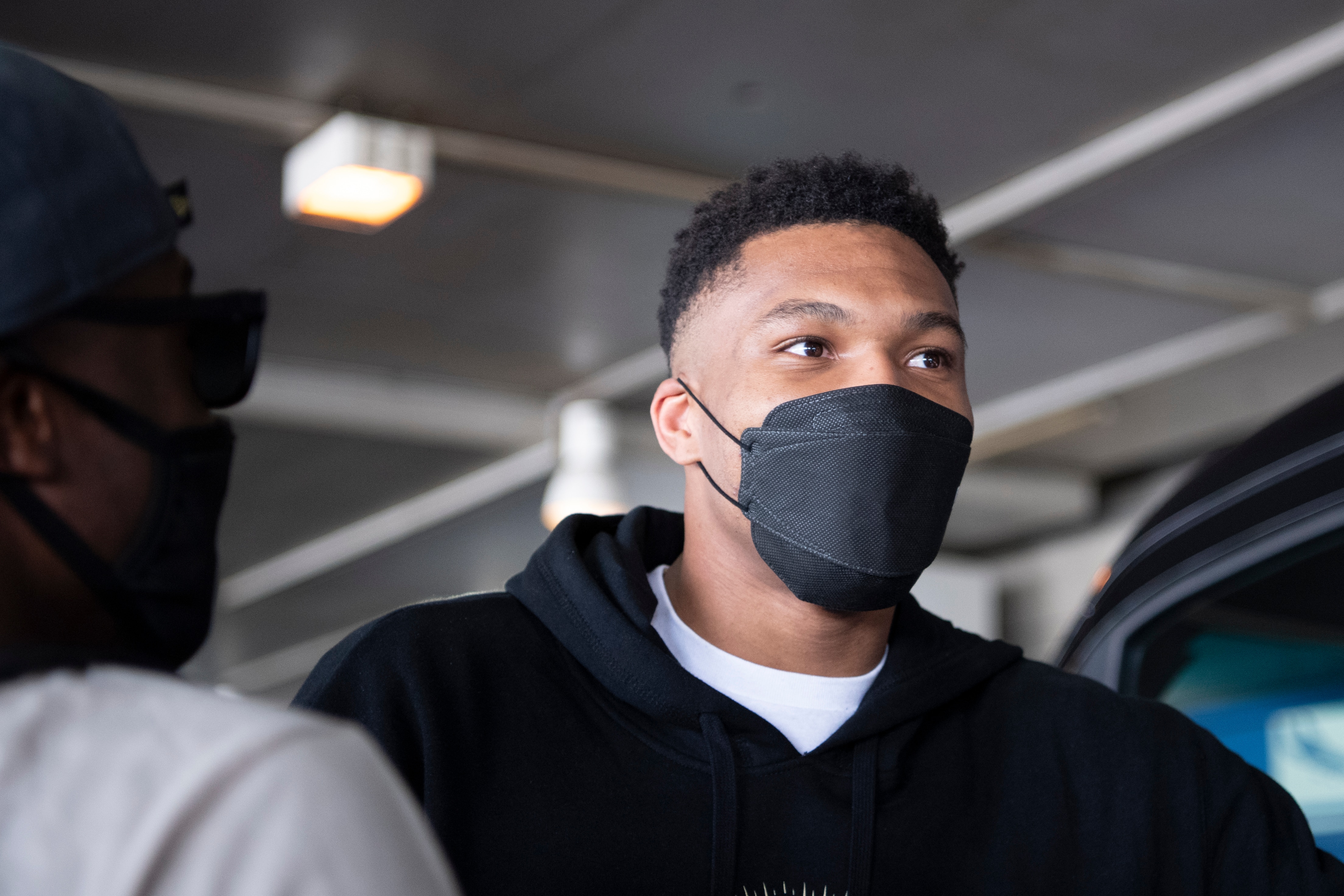 NBA Champion Giannis Antetokounmpo, of the Milwaukee Bucks, who was named NBA Finals Most Valuable Player, arrives at the Eleftherios Venizelos International Airport, in Athens, Greece, Sunday, Aug. 1, 2021. The NBA champion and finals MVP plans to stay in Greece for a few days, before returning to the U.S., where his girlfriend expects their second child later this month. (AP Photo/Michael Varaklas)