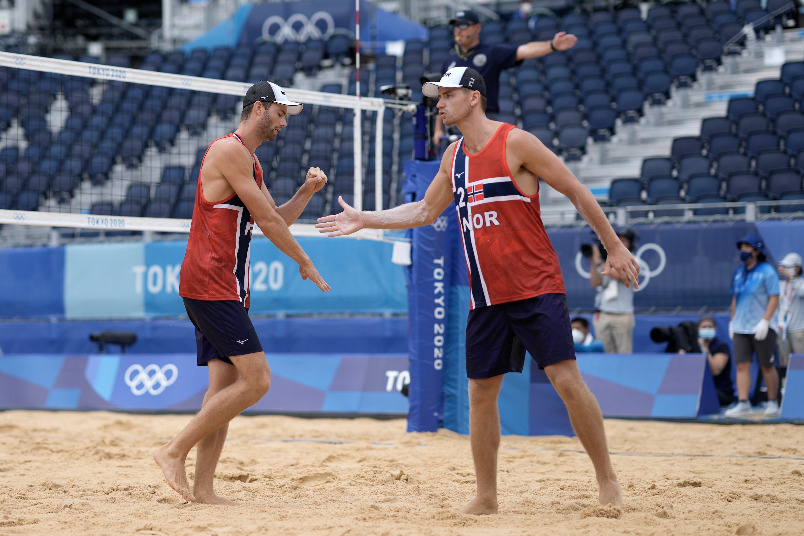 Anders Berntsen Mol, left, of Norway, celebrates a play with teammate Christian Sandlie Sorum during a men's beach volleyball Gold Medal match against the Russian Olympic Committee at the 2020 Summer Olympics, Saturday, Aug. 7, 2021, in Tokyo, Japan. (AP Photo/Petros Giannakouris)