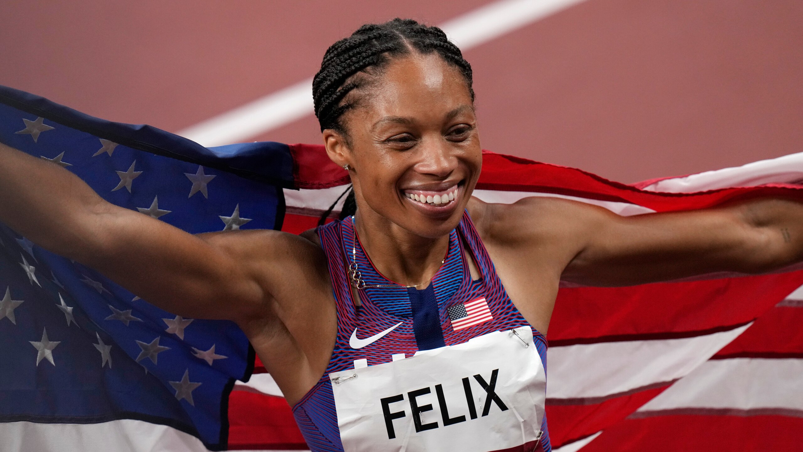 Allyson Felix, of the United States, smiles after taking the bronze, in the final of women's 400-meters at the 2020 Summer Olympics, Friday, Aug. 6, 2021, in Tokyo, Japan. (AP Photo/Francisco Seco)