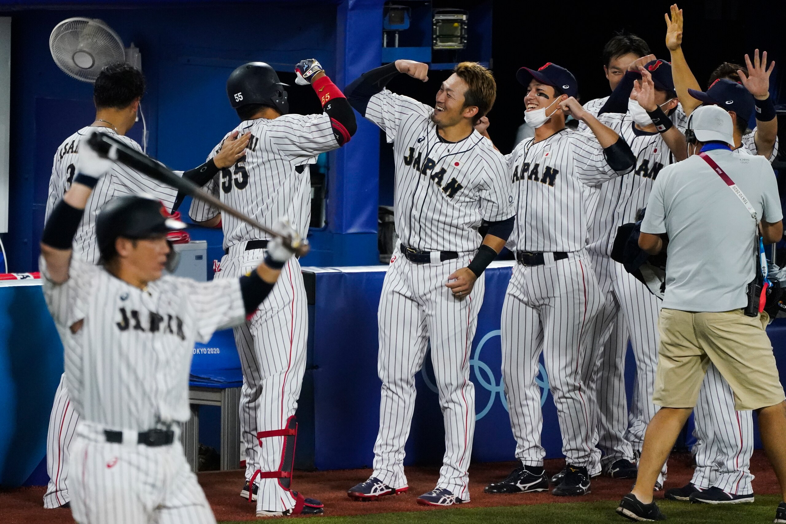 Japan's Munetaka Murakami celebrate (55) celebrate his home run with teammates during the gold medal baseball game against the United States at the 2020 Summer Olympics, Saturday, Aug. 7, 2021, in Yokohama, Japan. (AP Photo/Jae C. Hong)