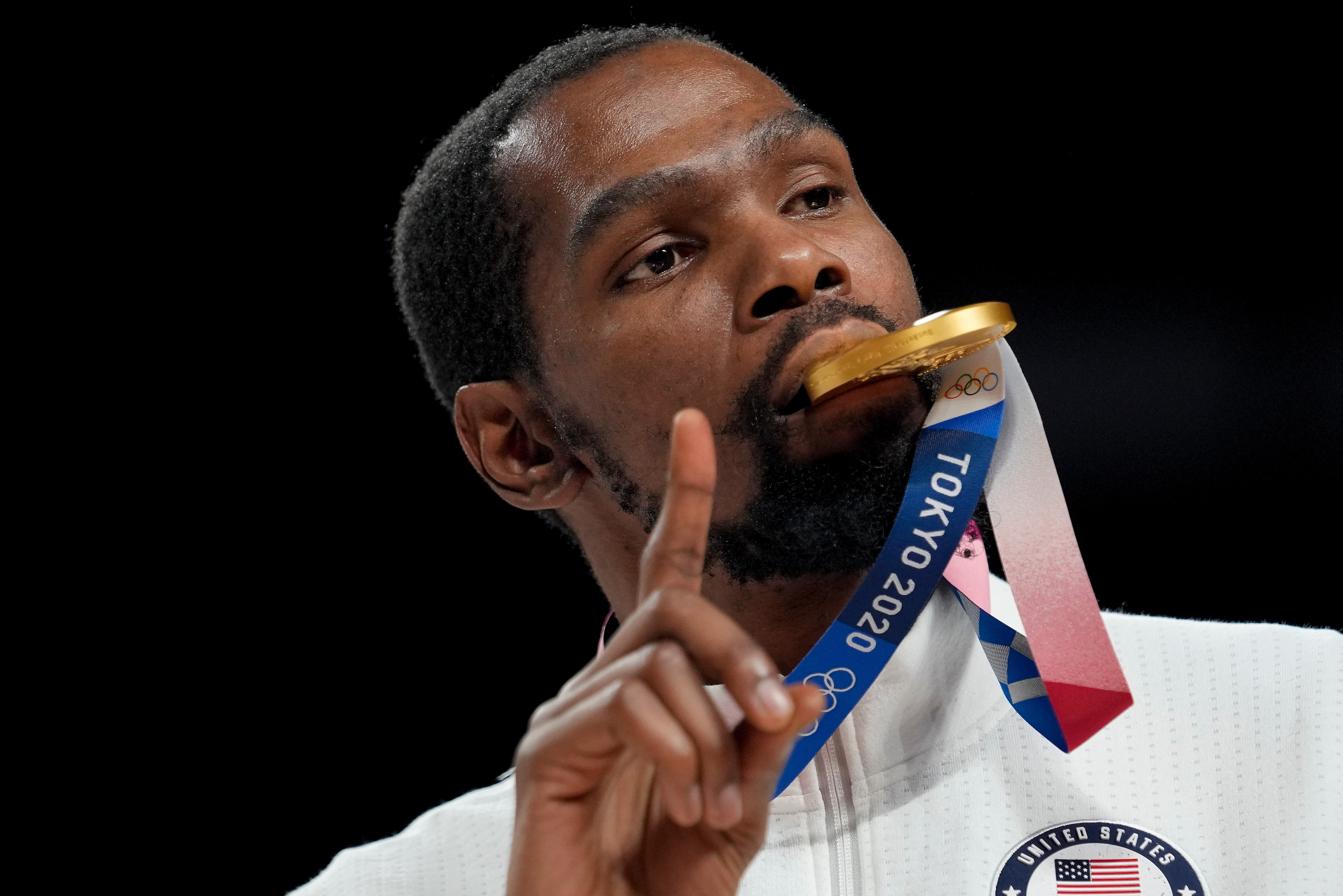 Kevin Durant poses for a photo with his gold medal during the medal ceremony for basketball game at the 2020 Summer Olympics, Saturday, Aug. 7, 2021, in Tokyo, Japan. (AP Photo/Eric Gay)