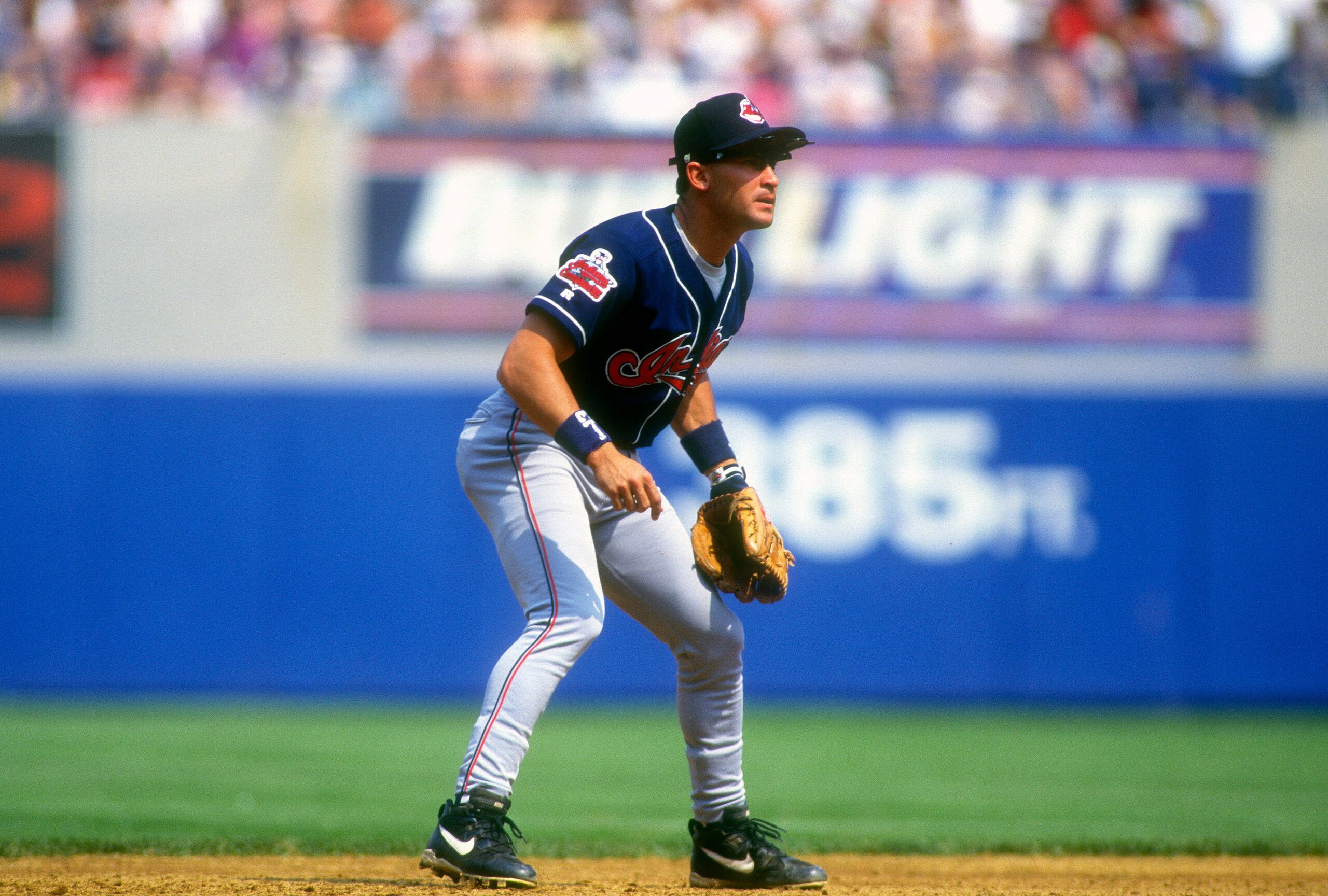 NEW YORK - CIRCA 1996: Omar Vizquel #13 of the Cleveland Indians is down and ready to make a play on the ball against the New York Yankees during an Major League Baseball game circa 1996 at Yankee Stadium in the Bronx borough of New York City. Vizquel played for the Indians from 1994-2004. (Photo by Focus on Sport/Getty Images)