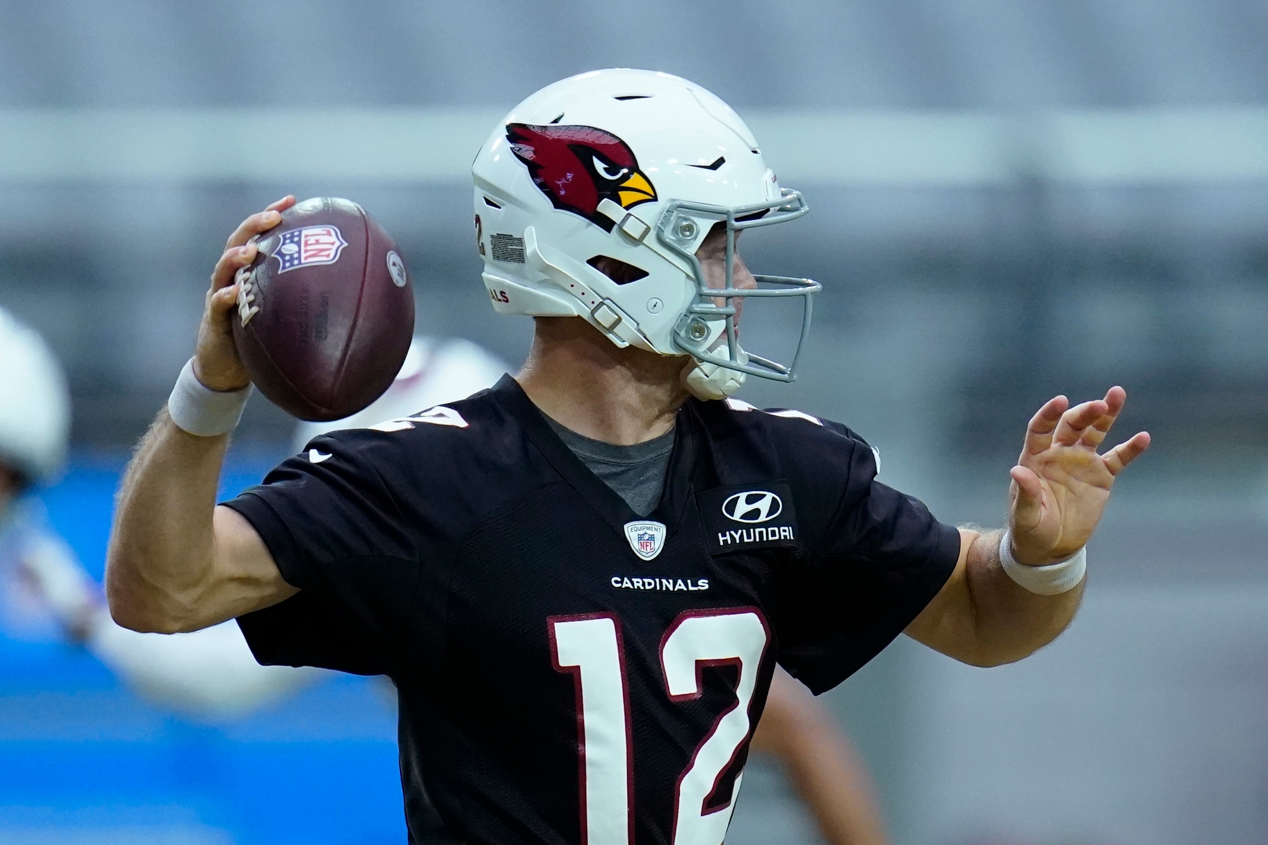 Arizona Cardinals quarterback Colt McCoy looks to pass the ball during an NFL football training camp practice, Wednesday, Aug. 4, 2021, in Glendale, Ariz. (AP Photo/Ross D. Franklin)