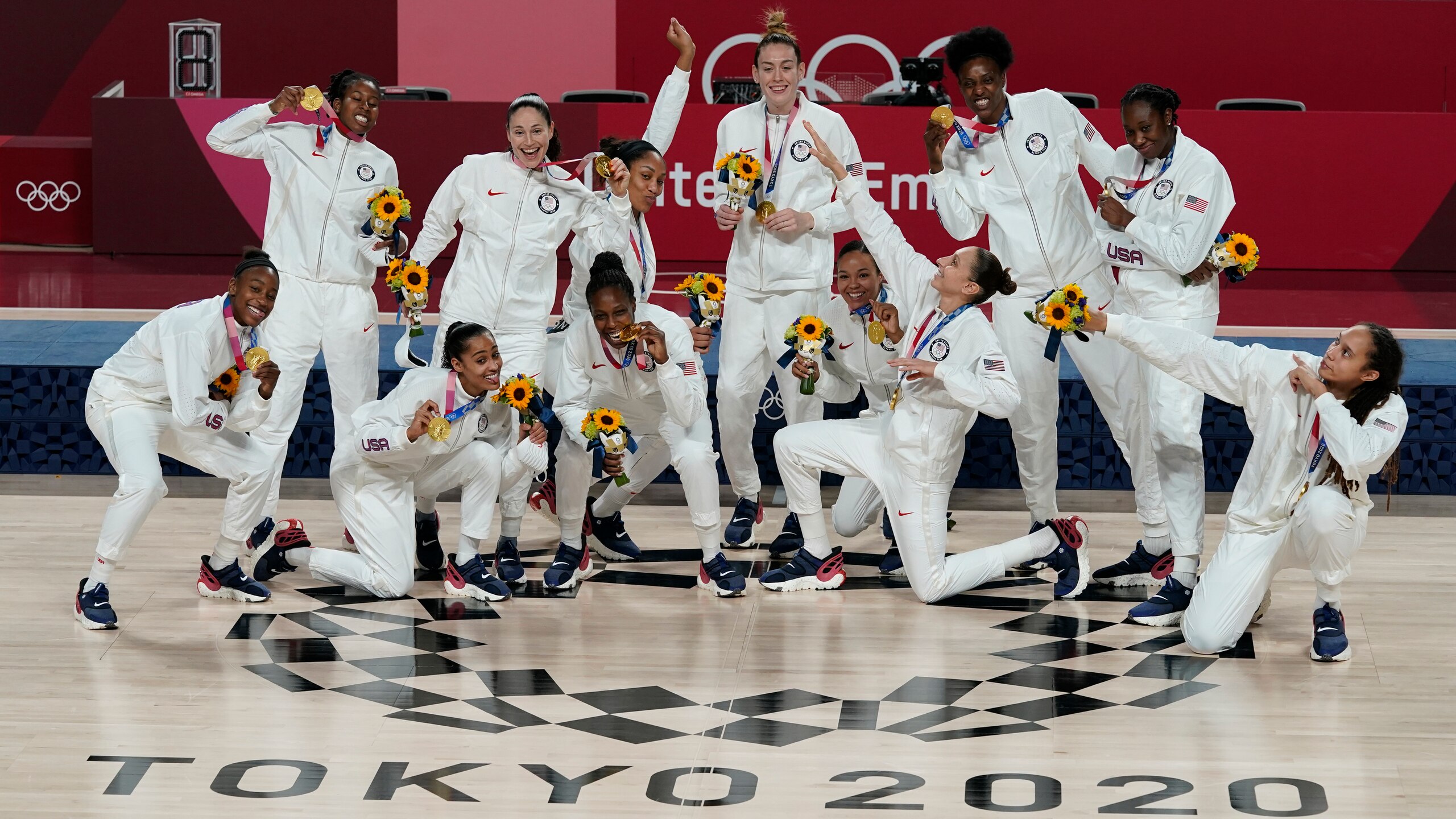 United States players pose with their gold medals during the medal ceremony for women's basketball at the 2020 Summer Olympics, Sunday, Aug. 8, 2021, in Saitama, Japan. (AP Photo/Charlie Neibergall)