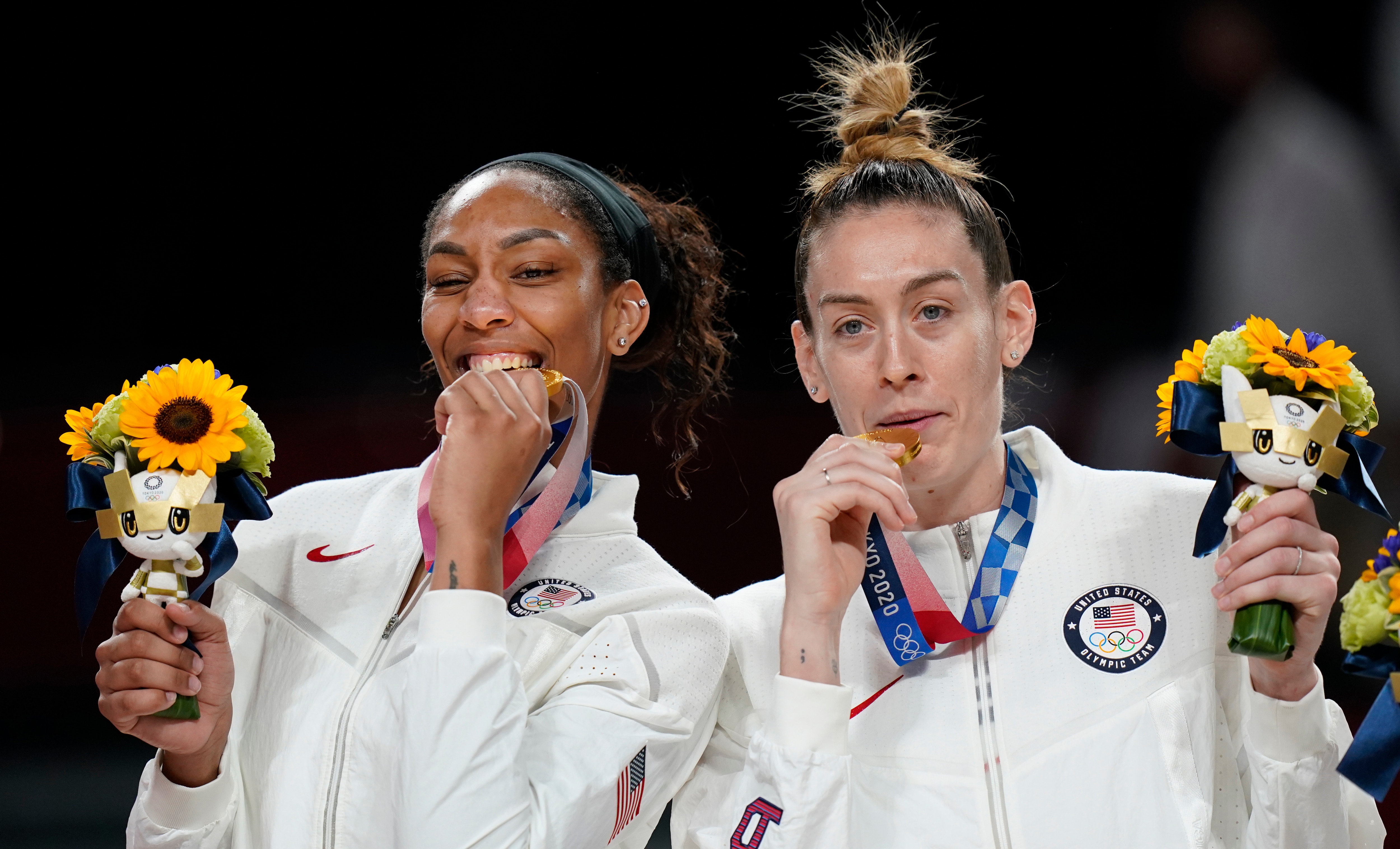 United States's Breanna Stewart, right, and A'Ja Wilson pose with their gold medals during the medal ceremony for women's basketball at the 2020 Summer Olympics, Sunday, Aug. 8, 2021, in Saitama, Japan. (AP Photo/Eric Gay)