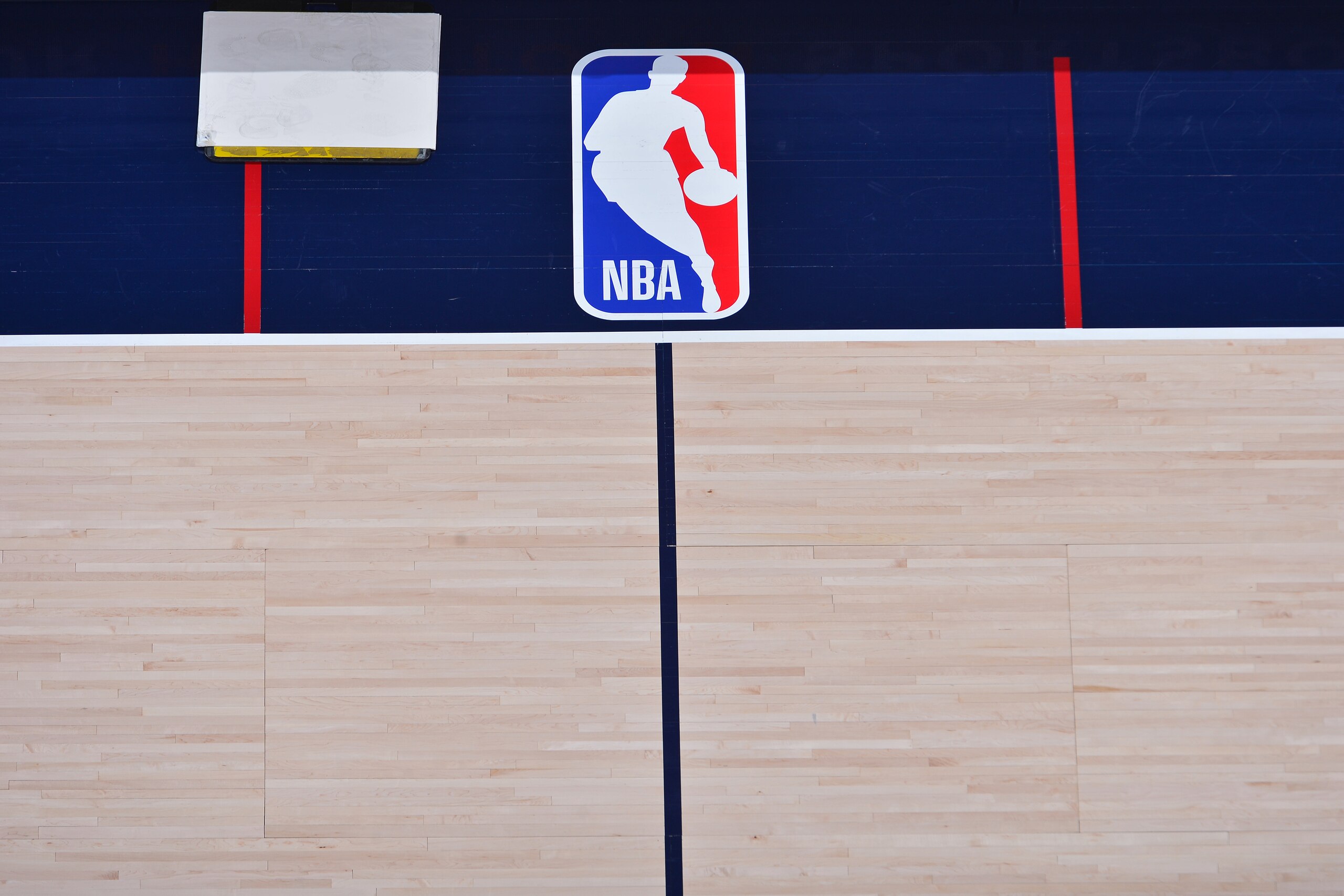 DENVER, CO - APRIL 6: The NBA logo pictured on the court on April 6, 2021 at the Ball Arena in Denver, Colorado. NOTE TO USER: User expressly acknowledges and agrees that, by downloading and/or using this Photograph, user is consenting to the terms and conditions of the Getty Images License Agreement. Mandatory Copyright Notice: Copyright 2021 NBAE (Photo by Bart Young/NBAE via Getty Images) DENVER, CO - APRIL 6: The NBA logo pictured on the court on April 6, 2021 at the Ball Arena in Denver, Colorado. NOTE TO USER: User expressly acknowledges and agrees that, by downloading and/or using this Photograph, user is consenting to the terms and conditions of the Getty Images License Agreement. Mandatory Copyright Notice: Copyright 2021 NBAE (Photo by Bart Young/NBAE via Getty Images)