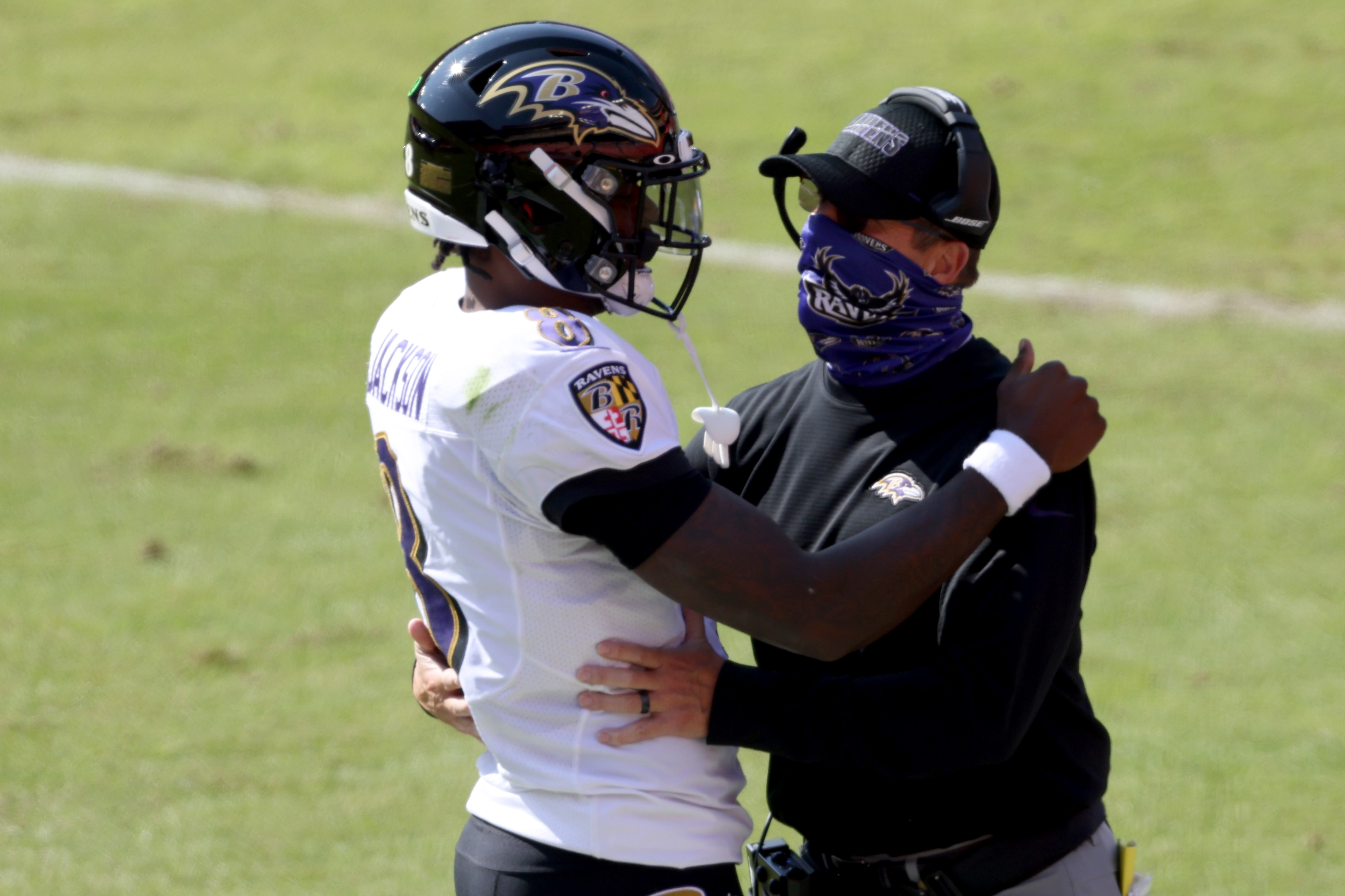 LANDOVER, MARYLAND - OCTOBER 04: Quarterback Lamar Jackson #8 of the Baltimore Ravens celebrates with head coach John Harbaugh after rushing for a second quarter touchdown against the Washington Football Team at FedExField on October 04, 2020 in Landover, Maryland. (Photo by Rob Carr/Getty Images)