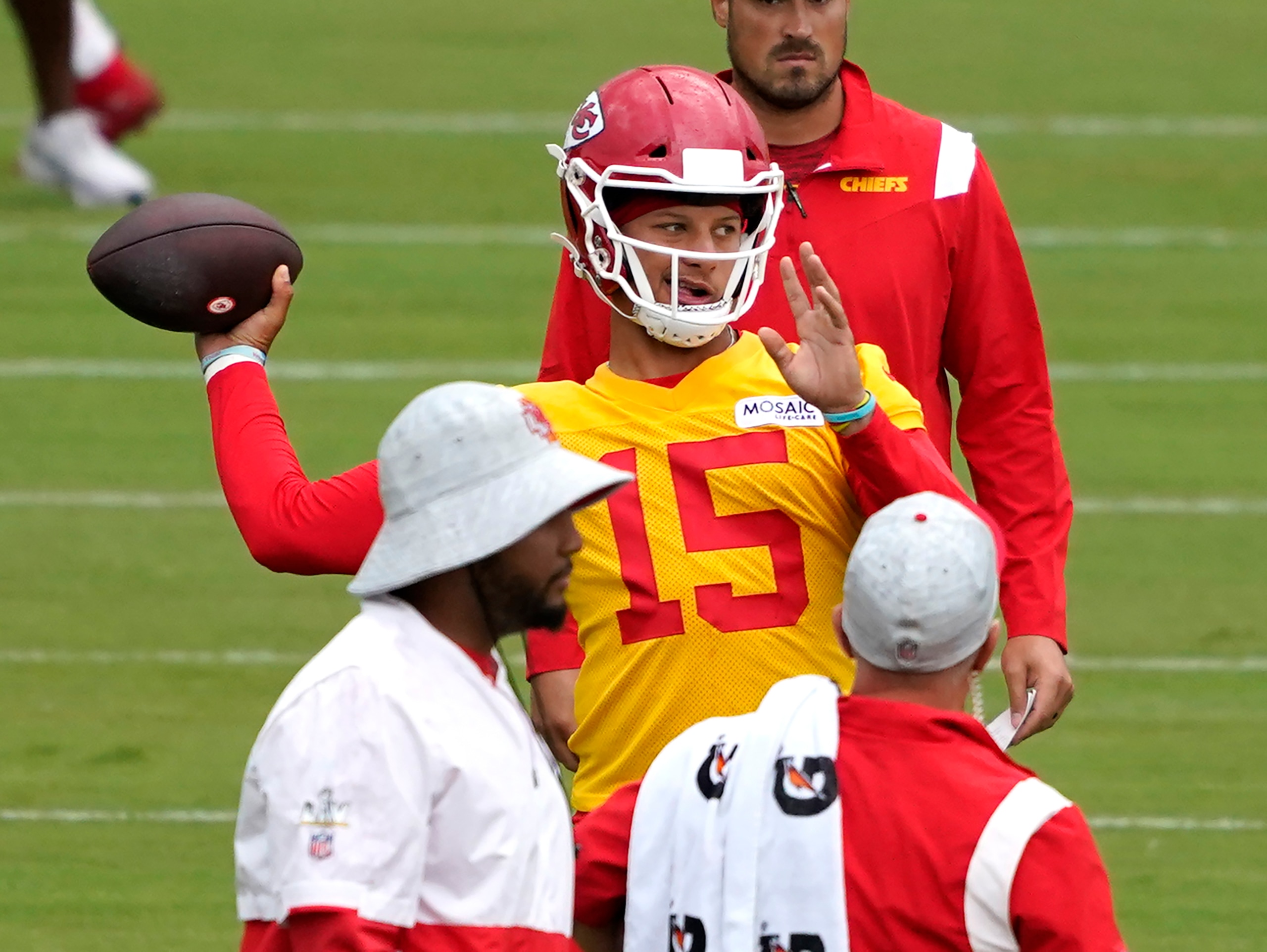 Kansas City Chiefs quarterback Patrick Mahomes (15) passes during drills at the team's NFL football training camp Saturday, July 31, 2021 in St. Joseph, Mo. (AP Photo/Ed Zurga)