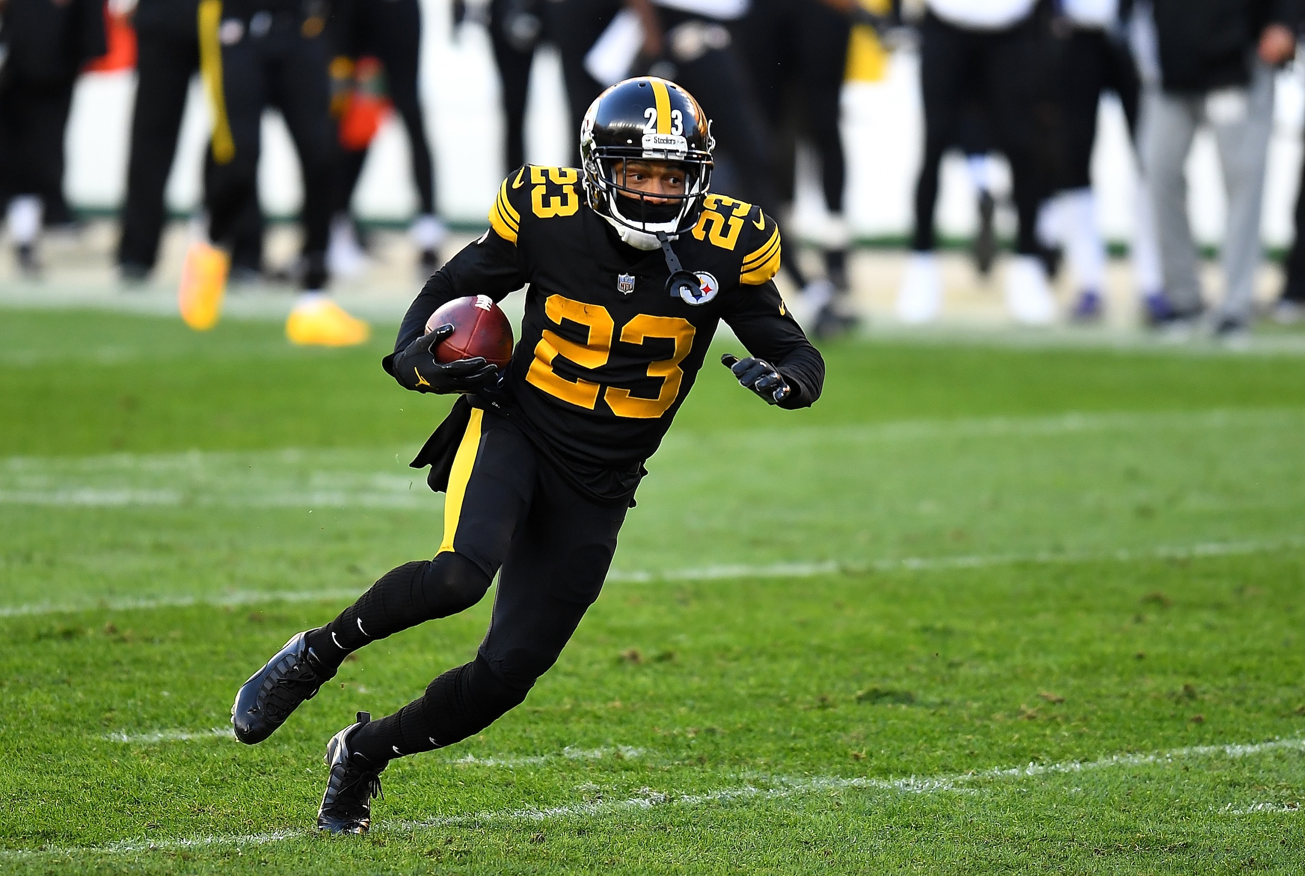 PITTSBURGH, PA - DECEMBER 02:  Joe Haden #23 of the Pittsburgh Steelers carries the ball for a touchdown  after intercepting a pass during the first quarter against the Baltimore Ravens at Heinz Field on December 1, 2020 in Pittsburgh, Pennsylvania. (Photo by Joe Sargent/Getty Images)