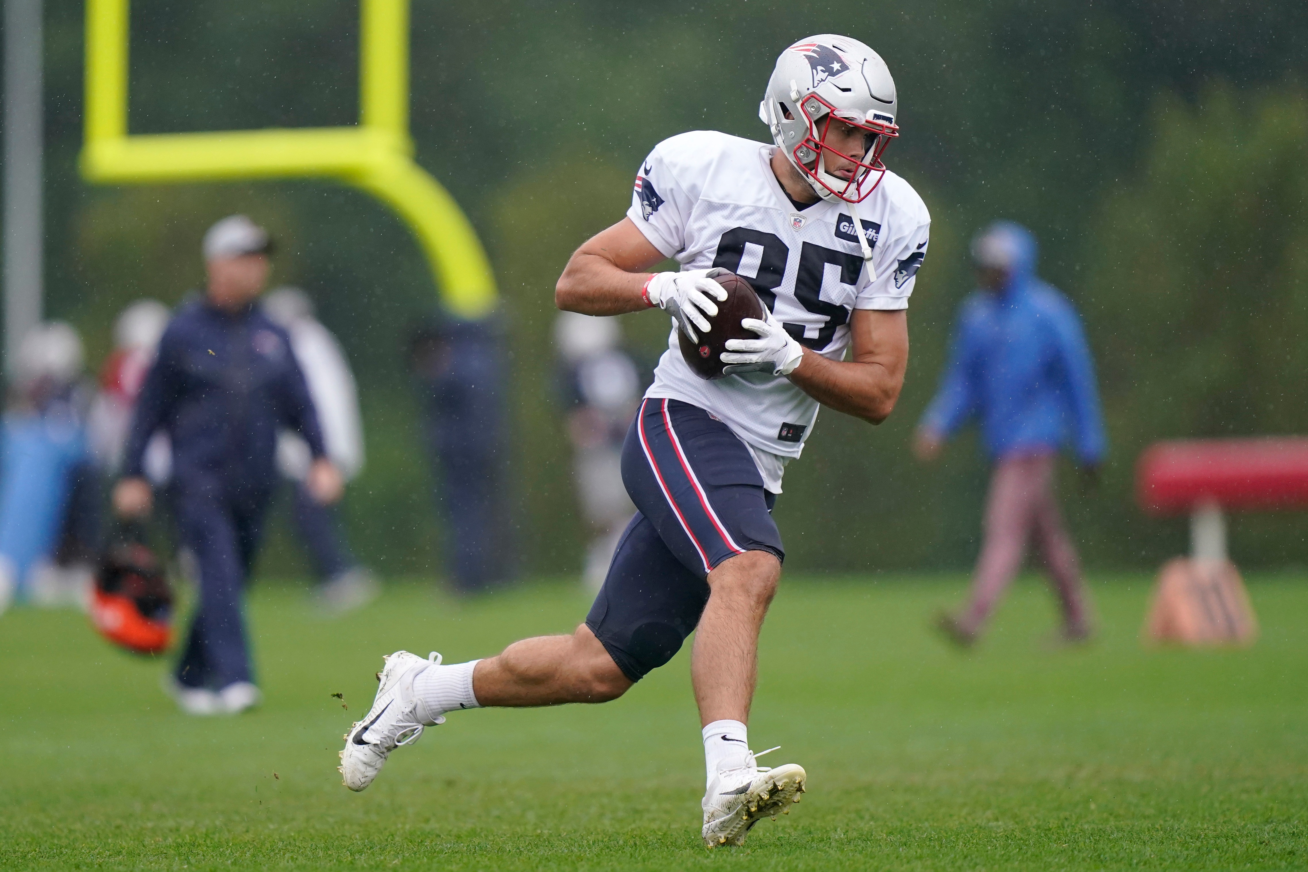 New England Patriots tight end Hunter Henry runs with the ball during an NFL football practice, Thursday, Aug. 5, 2021, in Foxborough, Mass. (AP Photo/Steven Senne)