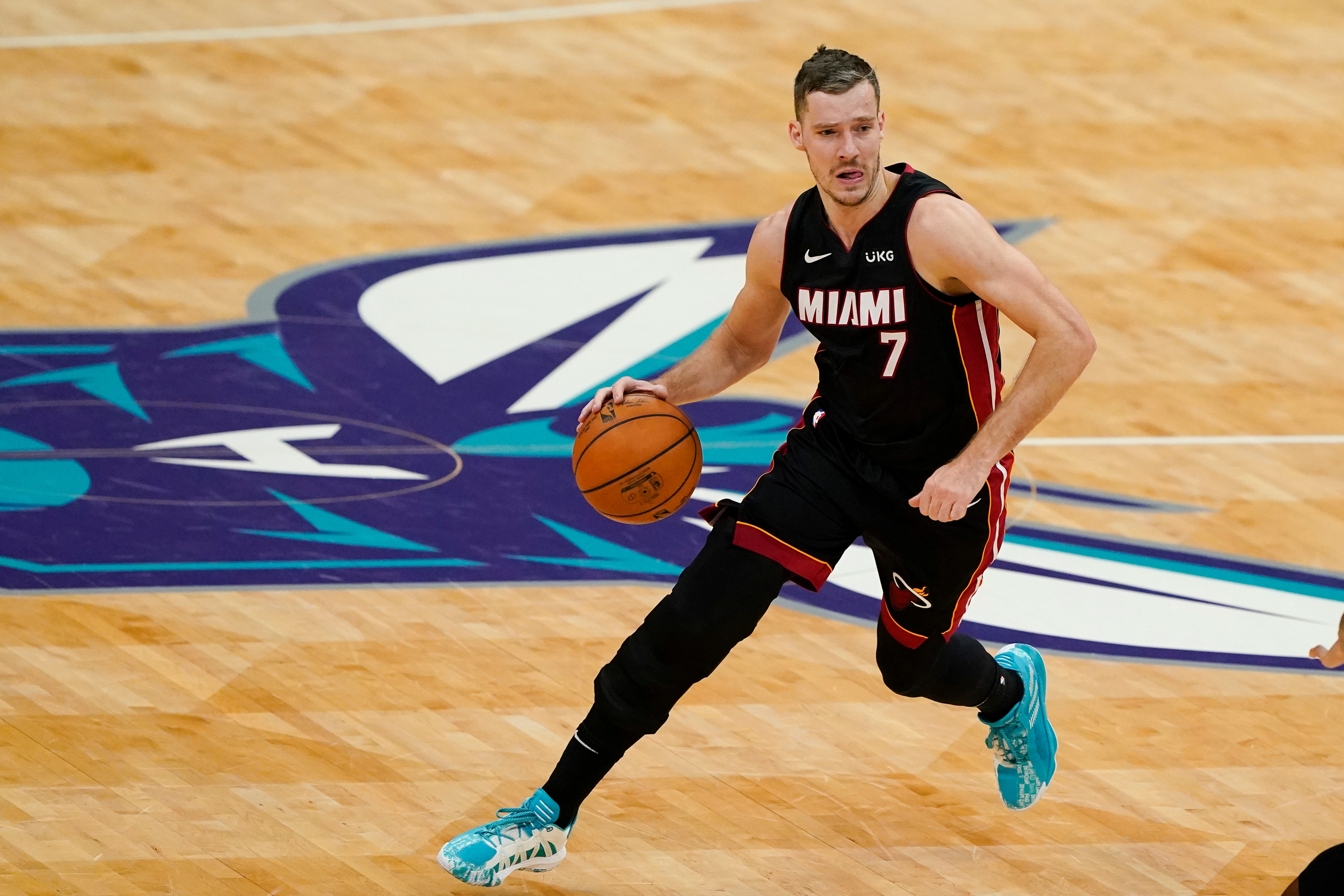 Miami Heat guard Goran Dragic brings the ball down court against the Charlotte Hornets during the first half of an NBA basketball game on Sunday, May 2, 2021, in Charlotte, N.C. (AP Photo/Chris Carlson)