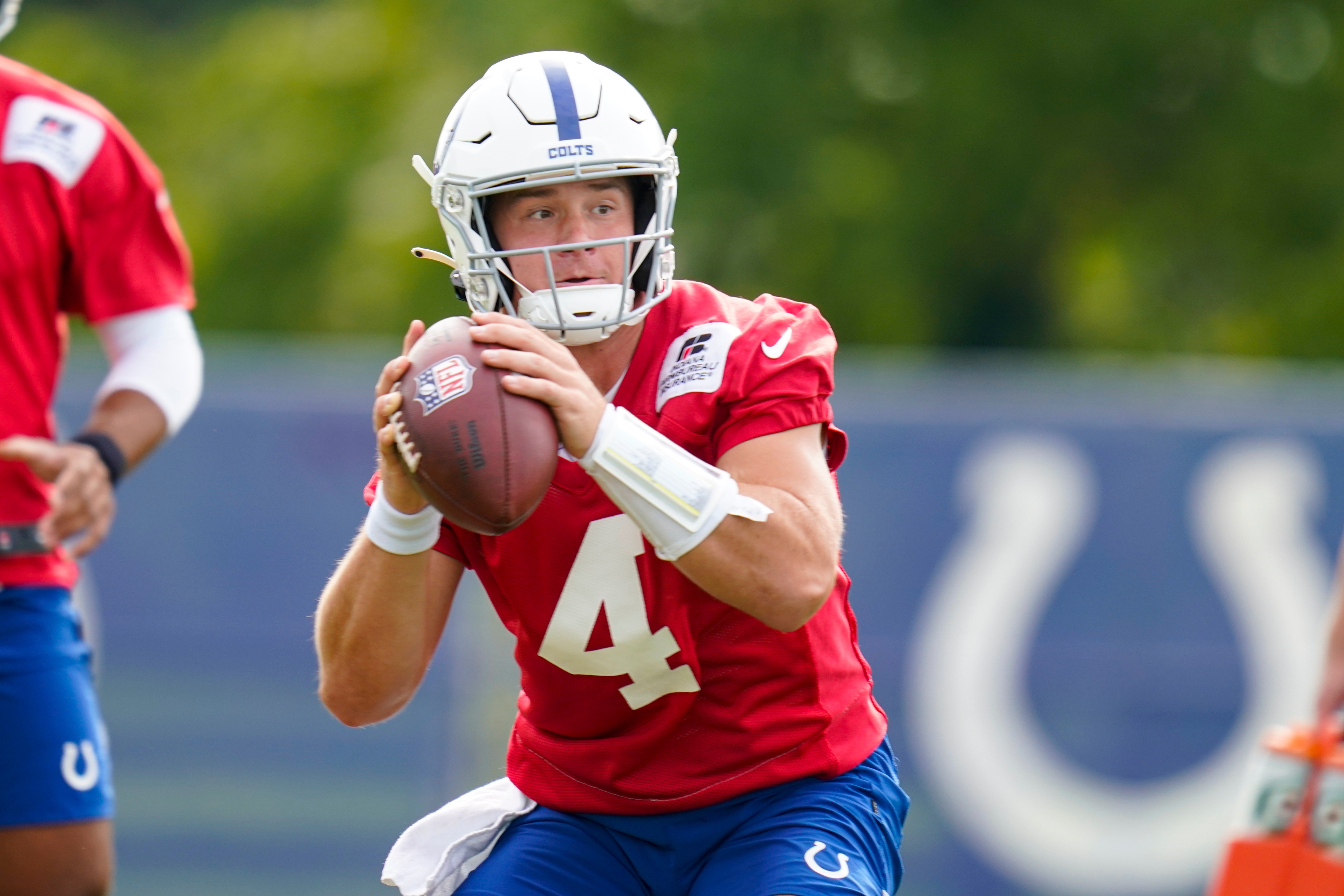 Indianapolis Colts quarterback Sam Ehlinger throws during practice at the NFL team's football training camp in Westfield, Ind., Friday, Aug. 6, 2021. (AP Photo/Michael Conroy)