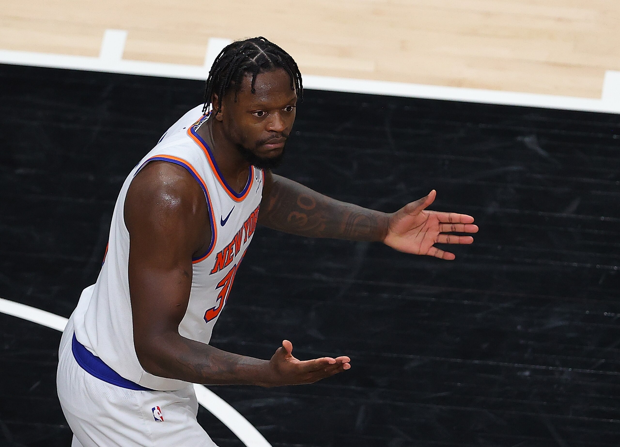 ATLANTA, GEORGIA - MAY 30:  Julius Randle #30 of the New York Knicks reacts against the Atlanta Hawks during game four of the Eastern Conference Quarterfinals at State Farm Arena on May 30, 2021 in Atlanta, Georgia.  NOTE TO USER: User expressly acknowledges and agrees that, by downloading and or using this photograph, User is consenting to the terms and conditions of the Getty Images License Agreement.  (Photo by Kevin C. Cox/Getty Images)