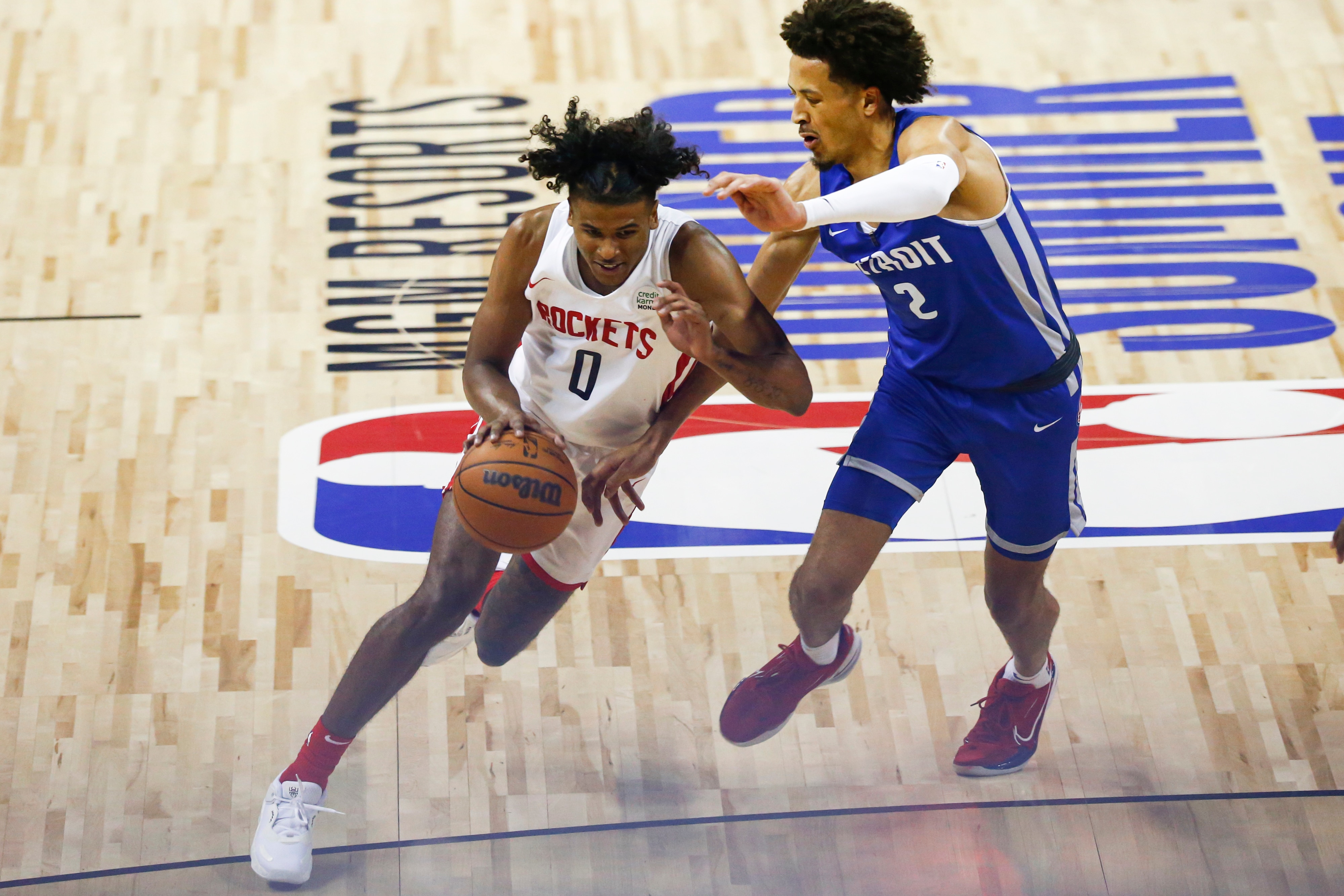 Houston Rockets' Jalen Green (0) drives to the basket under pressure from Detroit Pistons' Cade Cunningham (2) during the second half of an NBA summer league basketball game Tuesday, Aug. 10, 2021, in Las Vegas. (AP Photo/Chase Stevens)