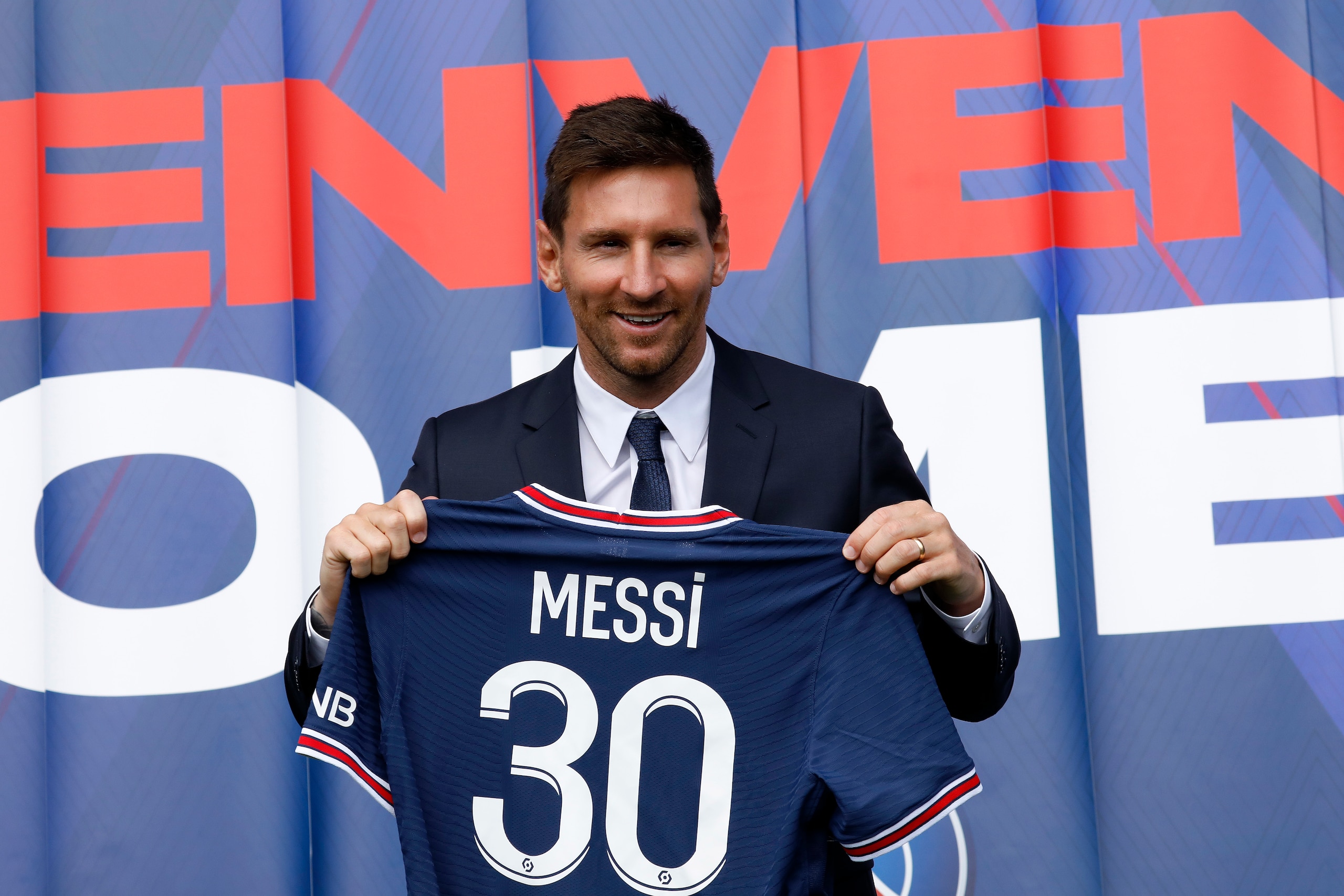PARIS, FRANCE - AUGUST 11: Lionel Messi poses with his jersey after a press conference where he was unveiled as a Paris Saint-Germain player at Parc des Princes on August 11, 2021 in Paris, France. (Photo by Antoine Gyori/ Corbis via Getty Images) PARIS, FRANCE - AUGUST 11: Lionel Messi poses with his jersey after a press conference where he was unveiled as a Paris Saint-Germain player at Parc des Princes on August 11, 2021 in Paris, France. (Photo by Antoine Gyori/ Corbis via Getty Images)