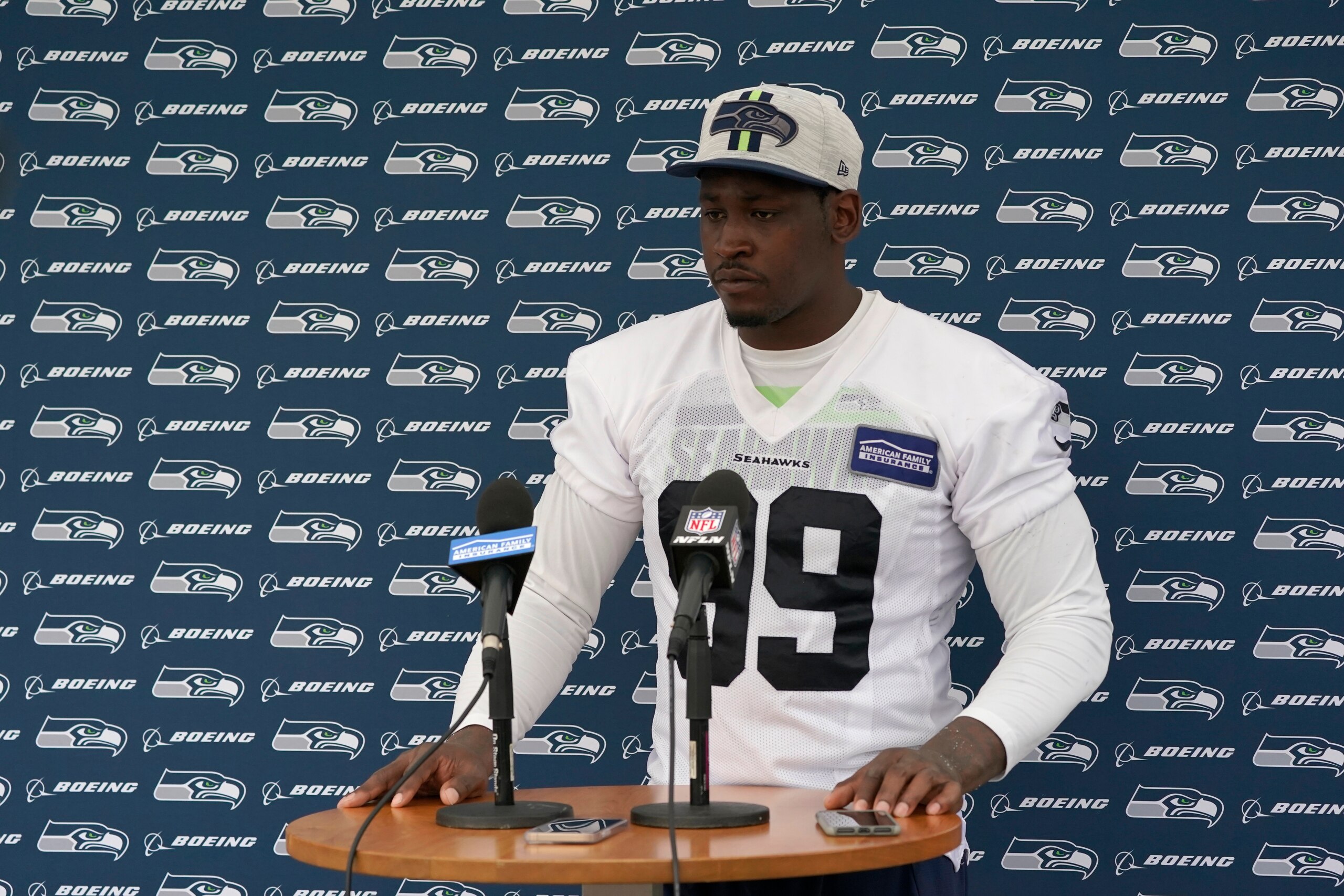 Seattle Seahawks defensive end Aldon Smith talks to reporters after NFL football practice Saturday, July 31, 2021, in Renton, Wash. (AP Photo/Ted S. Warren)