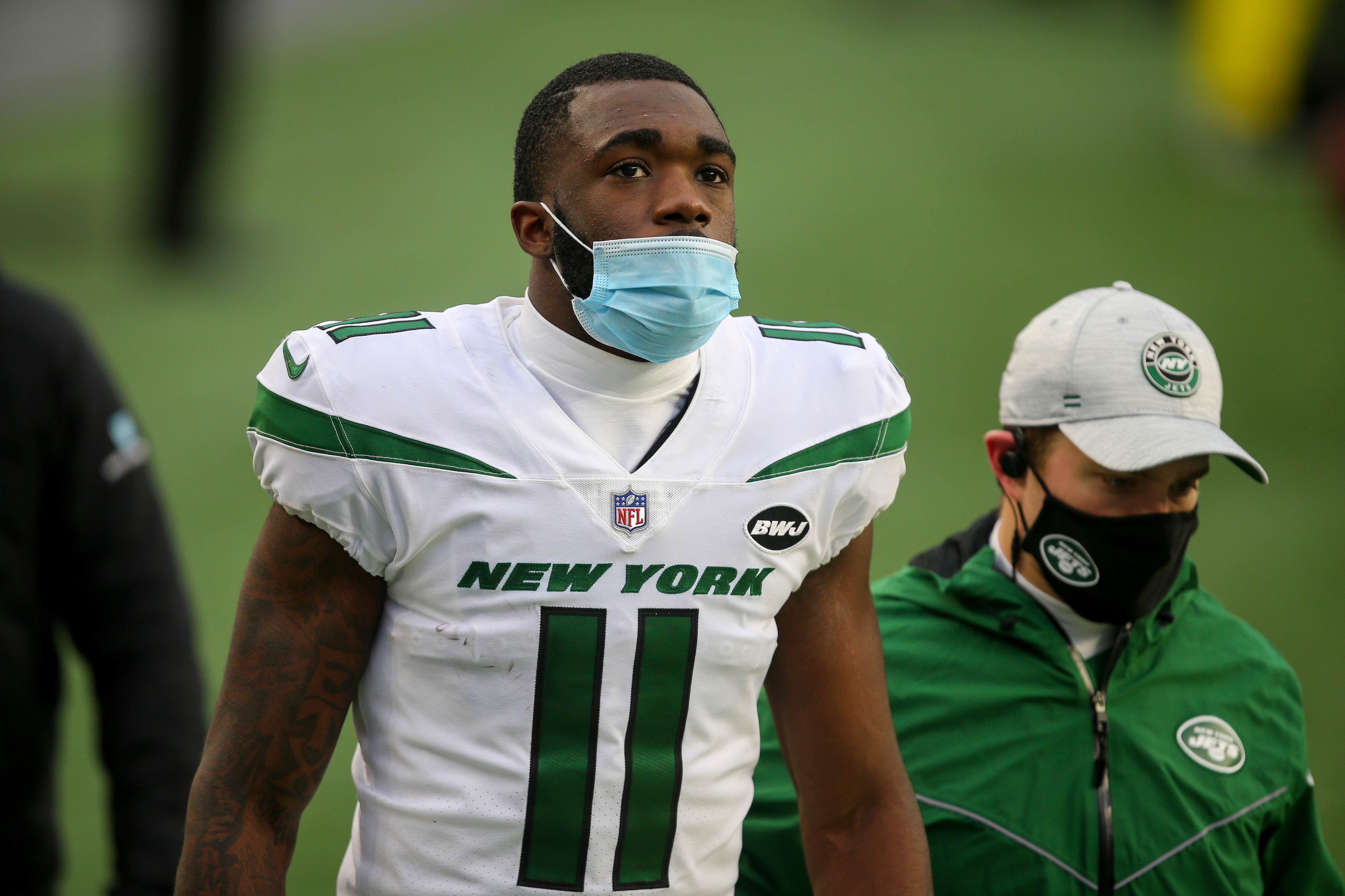 New York Jets wide receiver Denzel Mims (11) walks to the locker room after an injury during an NFL football game against the New England Patriots, Sunday, Jan. 3, 2021, in Foxborough, Mass. (AP Photo/Stew Milne)