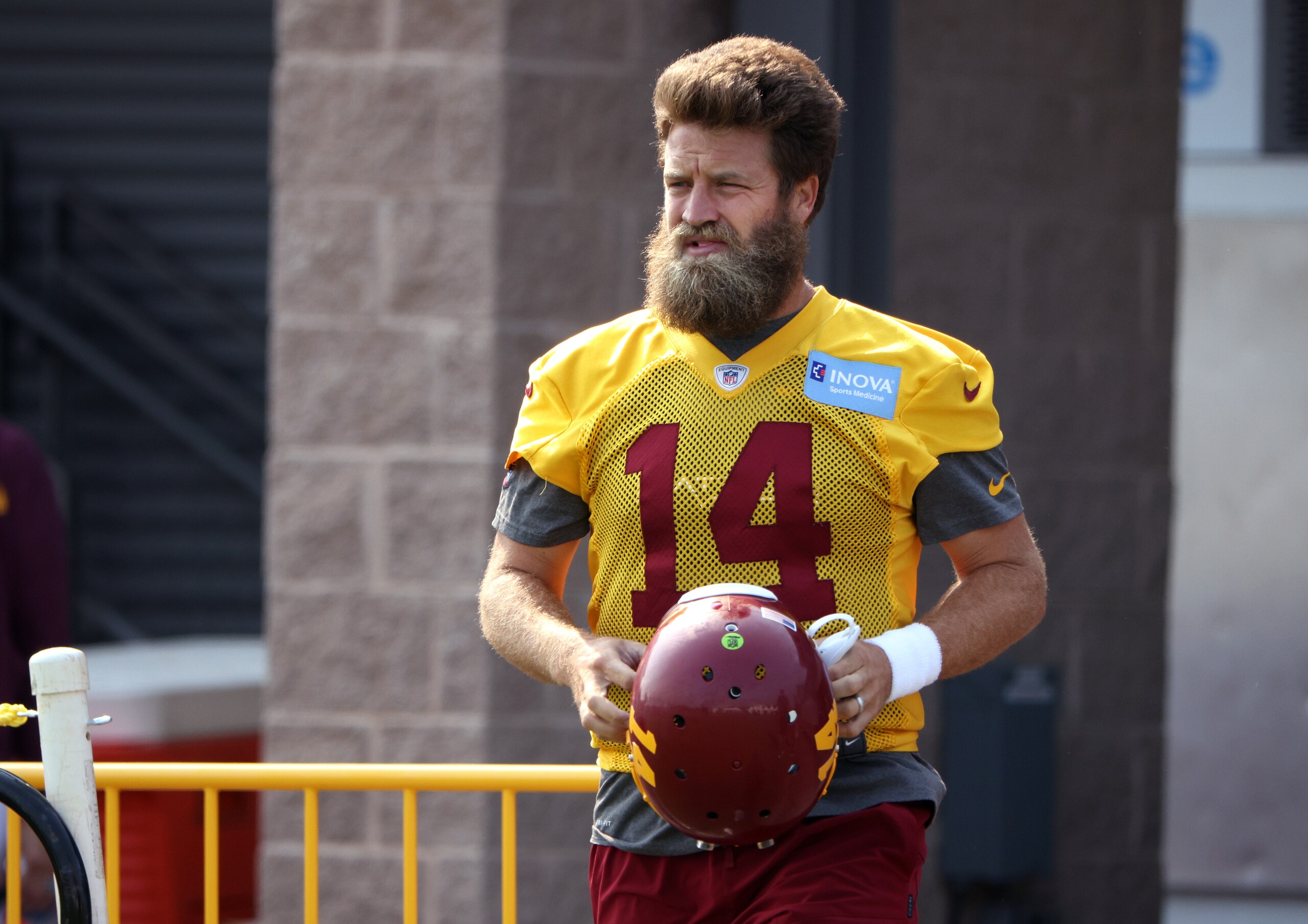 RICHMOND, VIRGINIA - JULY 29: Ryan Fitzpatrick #14 of the Washington Football Team takes the field during training camp at the Bon Secours Washington Football Team training center park on July 29, 2021 in Richmond, Virginia. (Photo by Kevin Dietsch/Getty Images)