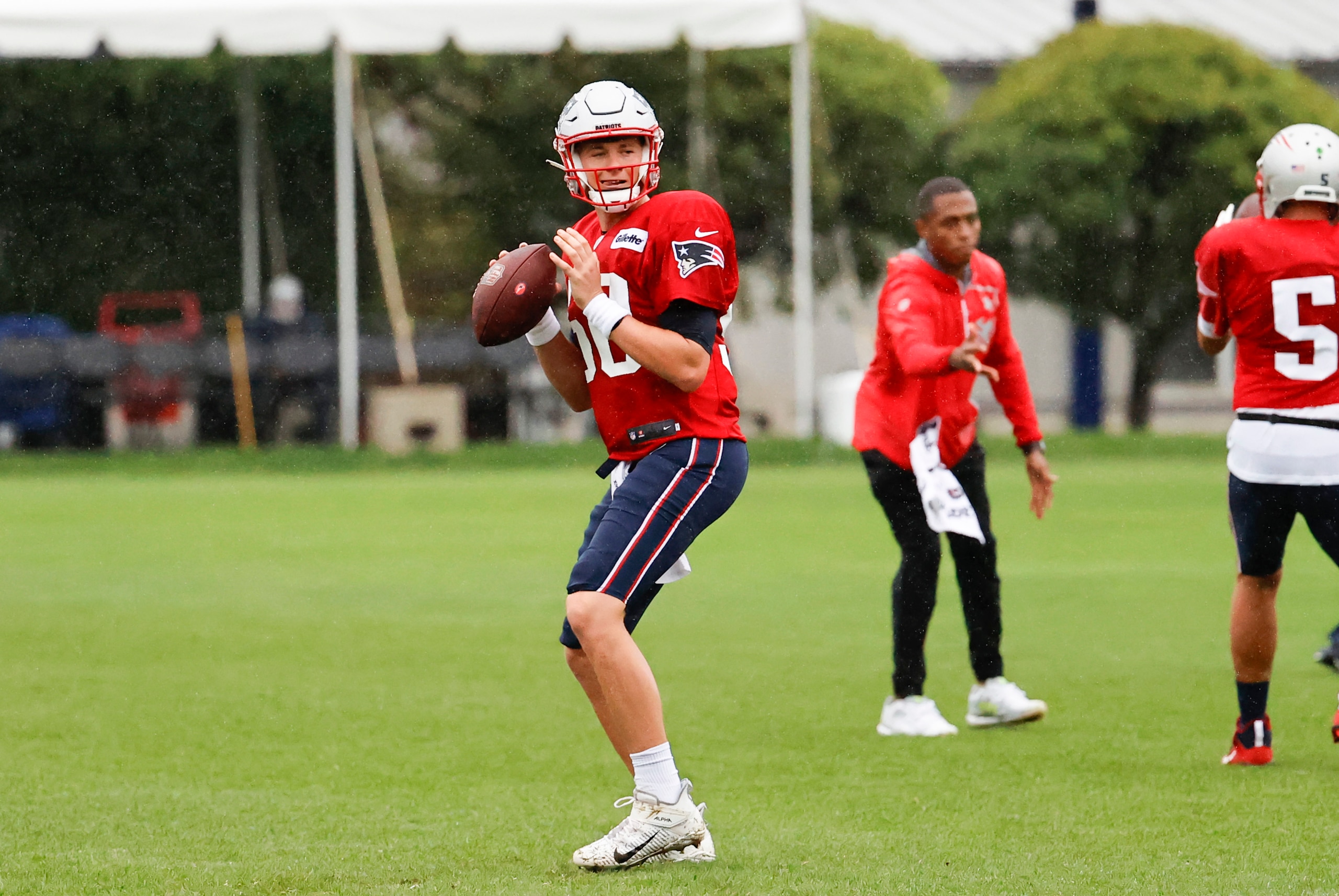 FOXBOROUGH, MA - AUGUST 05: New England Patriots quarterback Mac Jones (50) looks for a target during New England Patriots training camp on August 5, 2021, at Gillette Stadium in Foxborough, Massachusetts. (Photo by Fred Kfoury III/Icon Sportswire via Getty Images)