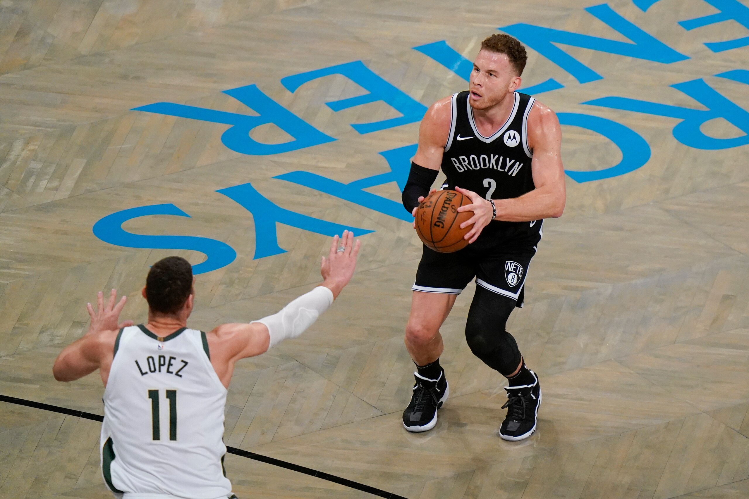 Brooklyn Nets' Blake Griffin (2) shoots over Milwaukee Bucks' Brook Lopez (11) during the first half of Game 7 of a second-round NBA basketball playoff series Saturday, June 19, 2021, in New York. (AP Photo/Frank Franklin II)