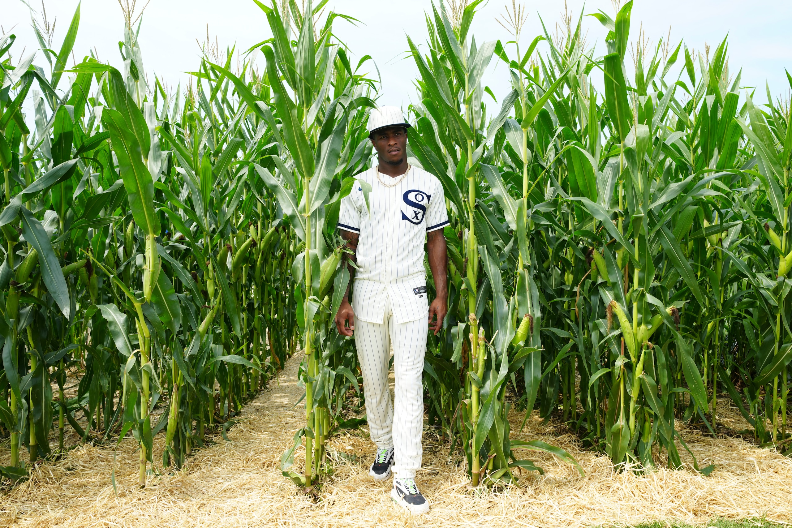 DYERSVILLE, IL - AUGUST 12:  Tim Anderson #7 of the Chicago White Sox walks through the Field of Dreams Movie Set before the game between the New York Yankees and the Chicago White Sox at MLB Field at Field of Dreams on Thursday, August 12, 2021 in Dyersville, Iowa. (Photo by Daniel Shirey/MLB Photos via Getty Images)