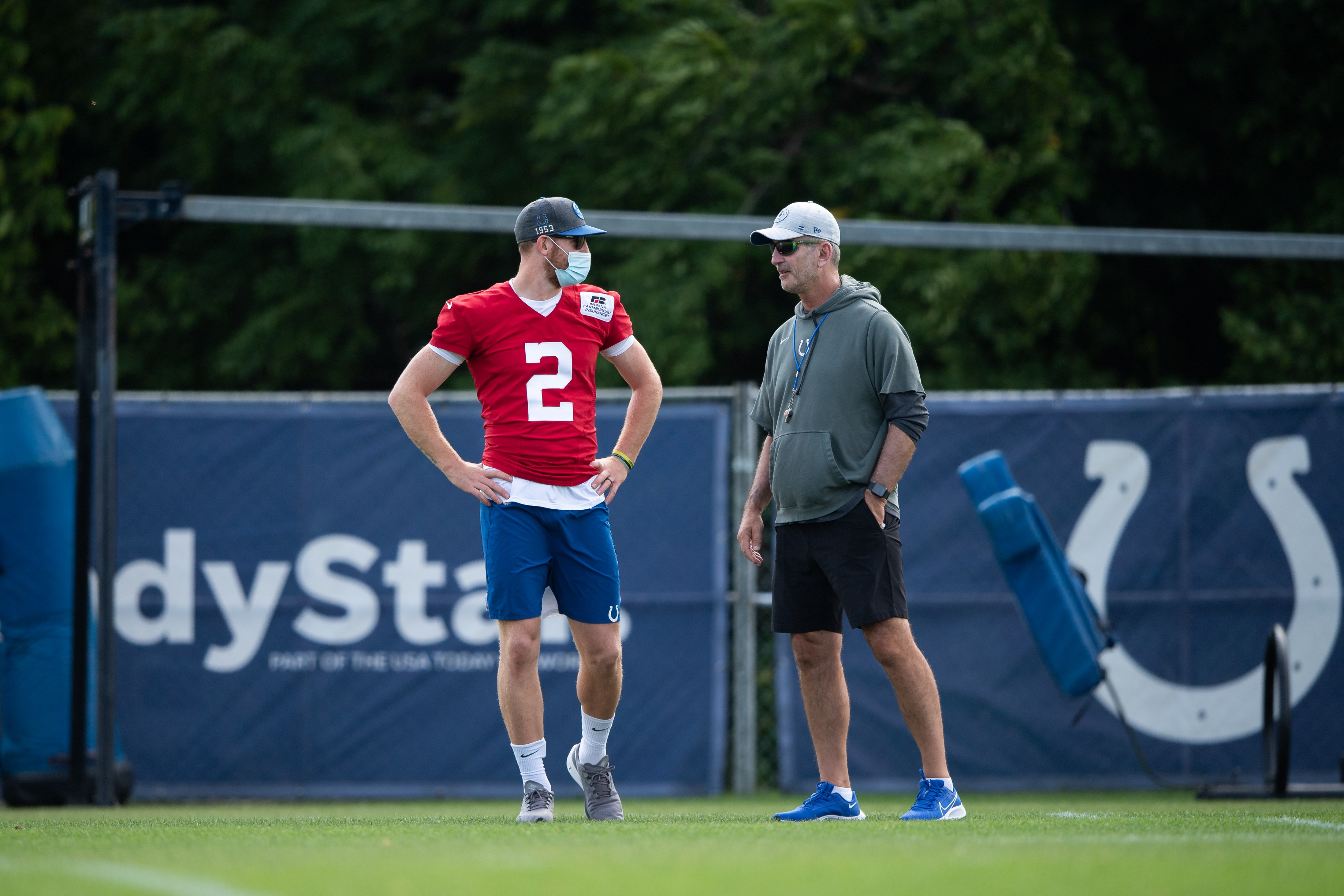 WESTFIELD, IN - AUGUST 07: Indianapolis Colts quarterback Carson Wentz (2) talks to Indianapolis Colts head coach Frank Reich during the Indianapolis Colts training camp practice on August 7, 2021 at Grand Park Sports Complex in Westfield, IN. (Photo by Zach Bolinger/Icon Sportswire via Getty Images)