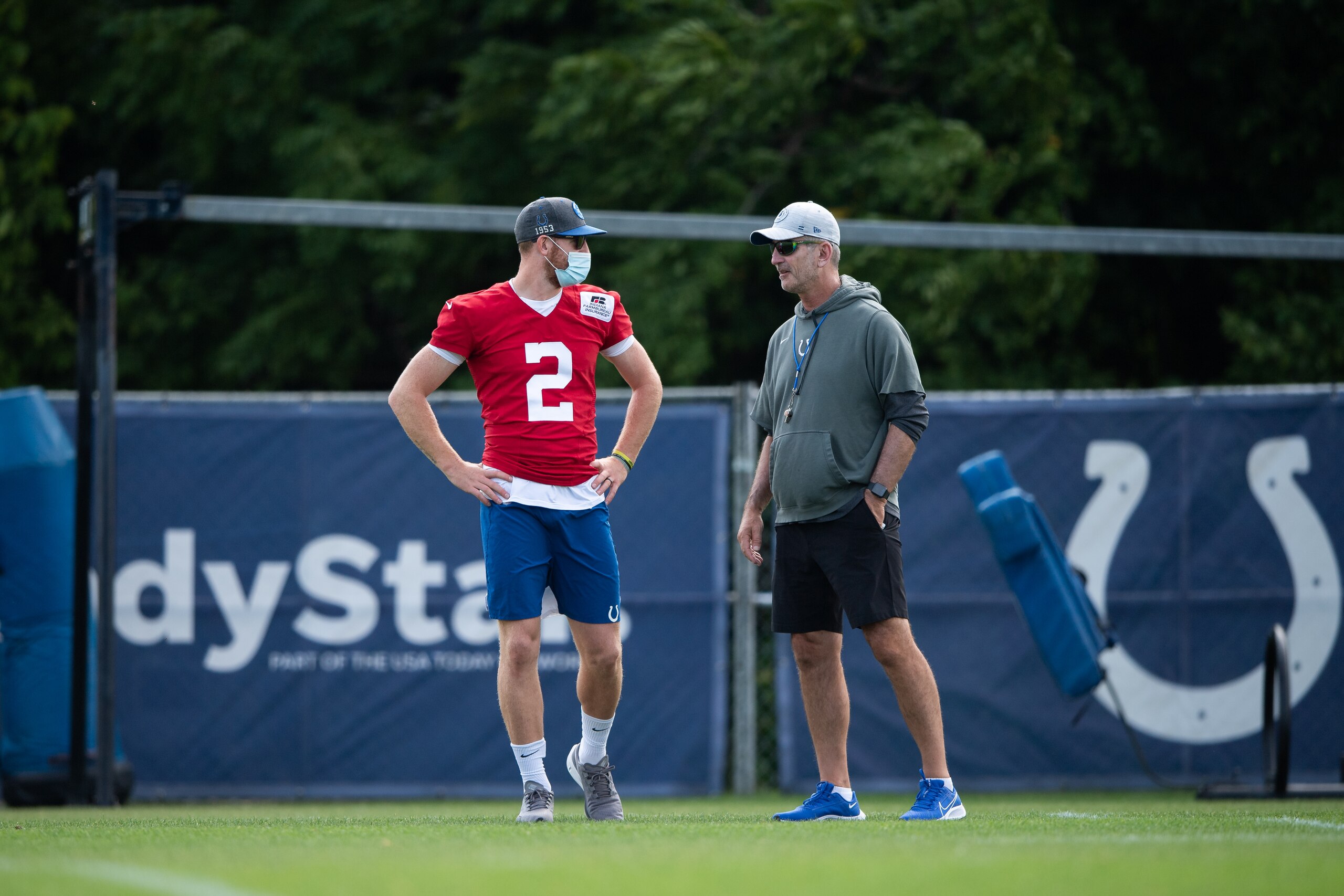 WESTFIELD, IN - AUGUST 07: Indianapolis Colts quarterback Carson Wentz (2) talks to Indianapolis Colts head coach Frank Reich during the Indianapolis Colts training camp practice on August 7, 2021 at Grand Park Sports Complex in Westfield, IN. (Photo by Zach Bolinger/Icon Sportswire via Getty Images)