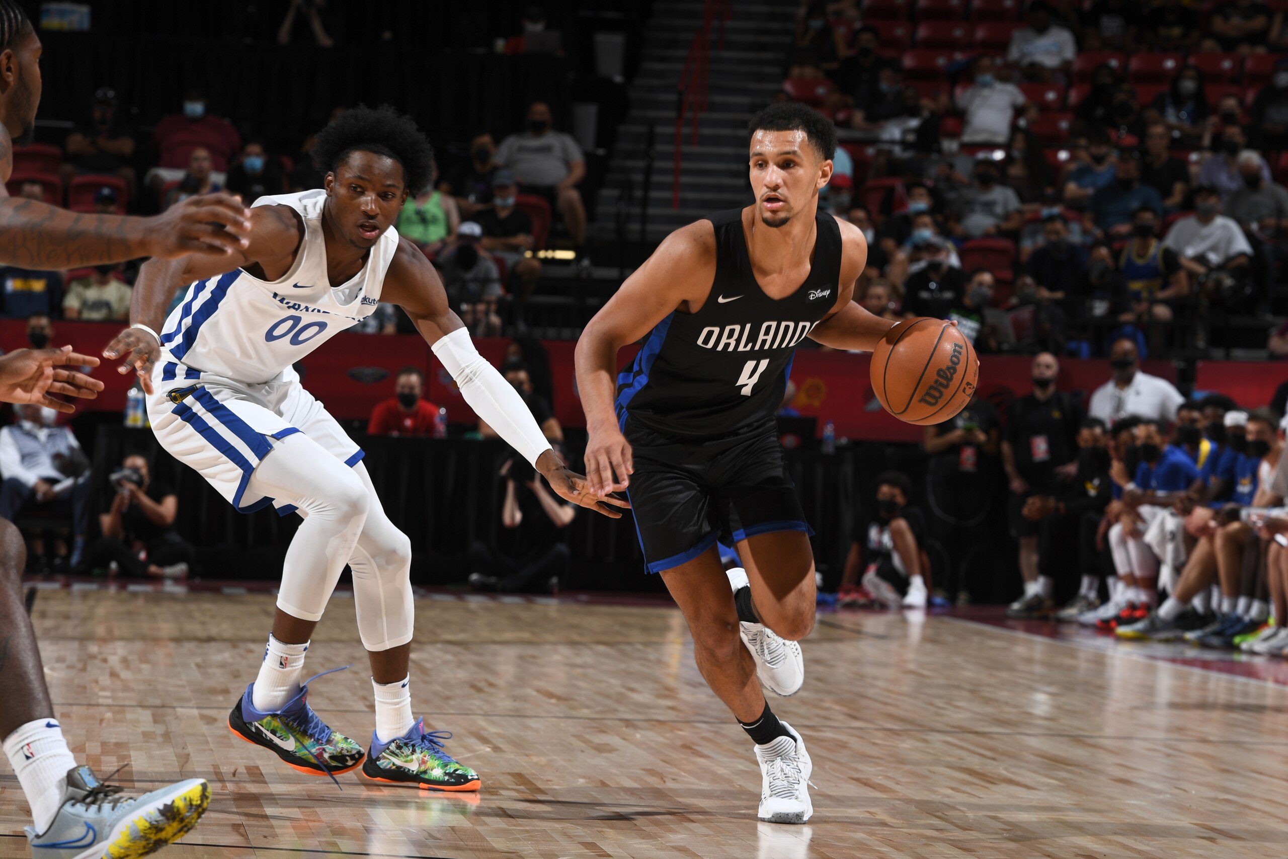 LAS VEGAS, NV - AUGUST 9: Jalen Suggs #4 of the Orlando Magic handles the ball against the Golden State Warriors during the 2021 Las Vegas Summer League on August 9, 2021 at the Thomas & Mack Center in Las Vegas, Nevada. NOTE TO USER: User expressly acknowledges and agrees that, by downloading and/or using this Photograph, user is consenting to the terms and conditions of the Getty Images License Agreement. Mandatory Copyright Notice: Copyright 2021 NBAE (Photo by Garrett Ellwood/NBAE via Getty Images)