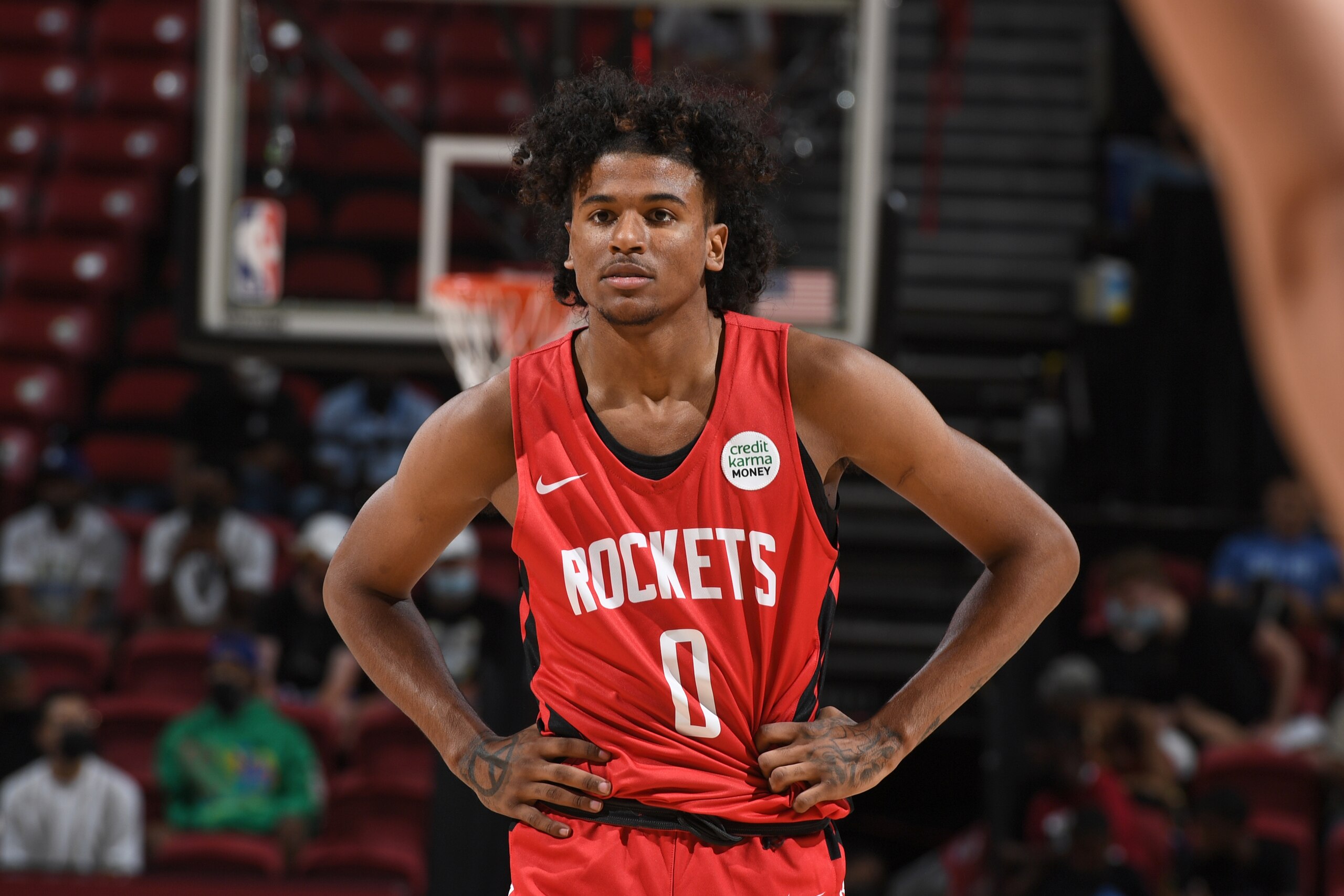 LAS VEGAS, NV - AUGUST 12:  Jalen Green #0 of the Houston Rockets looks on during the game against the Toronto Raptors during the 2021 Las Vegas Summer League on August 12, 2021 at the Thomas & Mack Center in Las Vegas, Nevada. NOTE TO USER: User expressly acknowledges and agrees that, by downloading and or using this Photograph, User is consenting to the terms and conditions of the Getty Images License Agreement. Mandatory Copyright Notice: Copyright 2021 NBAE (Photo by Garrett Ellwood/NBAE via Getty Images)
