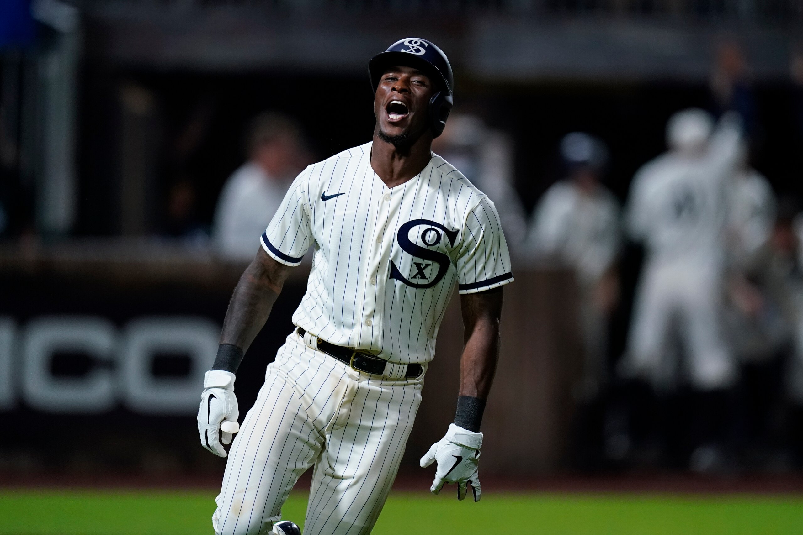 Chicago White Sox shortstop Tim Anderson (7) celebrates his walk-off home run against the New York Yankees in the ninth inning during a baseball game, Thursday, Aug. 12, 2021 in Dyersville, Iowa. The Yankees and White Sox are playing at a temporary stadium in the middle of a cornfield at the Field of Dreams movie site, the first Major League Baseball game held in Iowa. The White Sox won 9-8. (AP Photo/Charlie Neibergall)