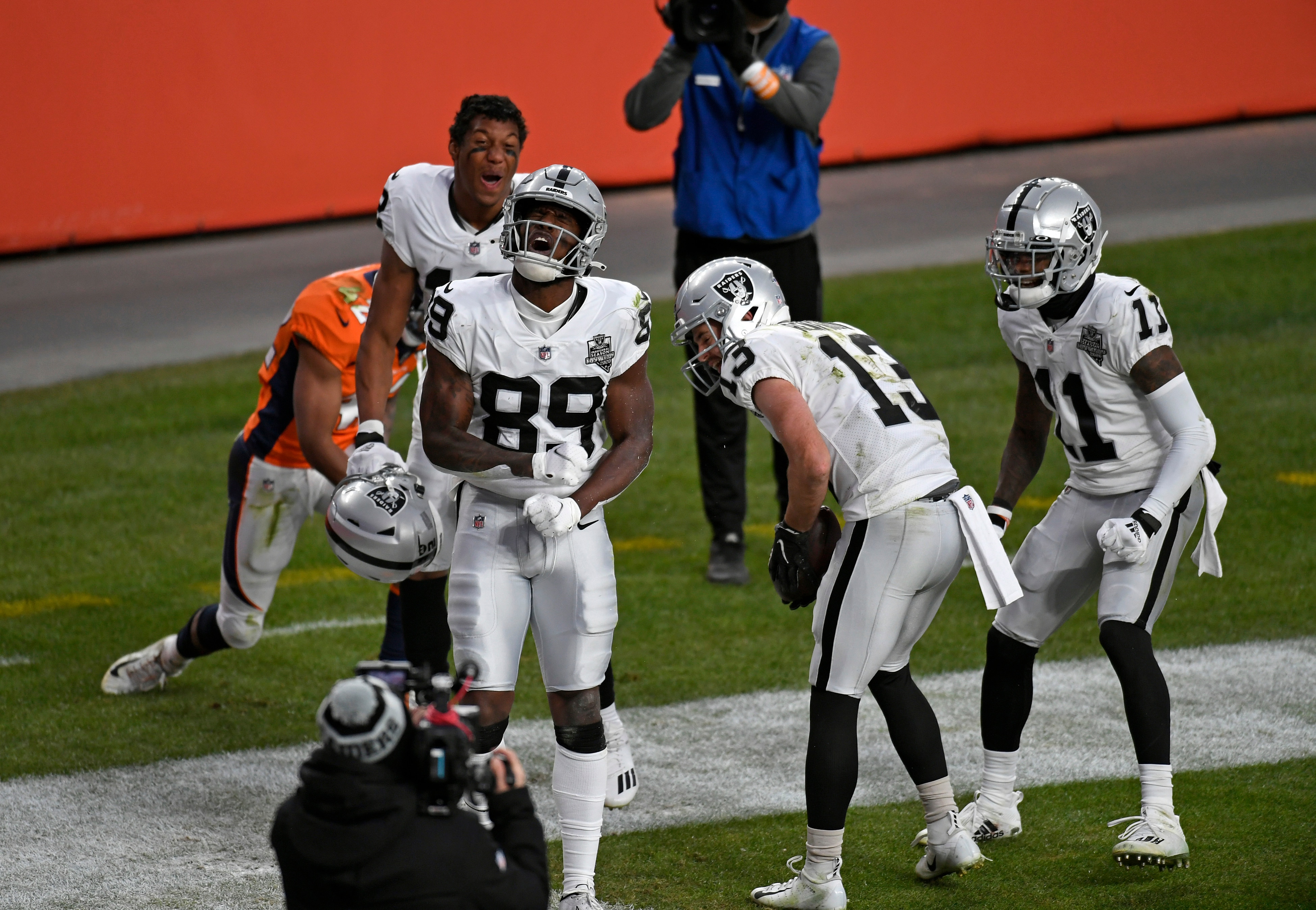 DENVER, COLORADO - JANUARY 3:  Las Vegas Raiders Bryan Edwards, #89, celebrates his second quarter touchdown with teammates and wide receivers Zay Jones, #12, second from left, Hunter Renfrow, #13, second from right, and Henry Ruggs III, #11, right, at Empower Field at Mile High as the Broncos take on the Las Vegas Raiders in their final game of the year on January 3, 2021 in Denver, Colorado. The Denver Broncos lost to the Las Vegas Raiders 32-31. (Photo by Helen H. Richardson/MediaNews Group/The Denver Post via Getty Images)