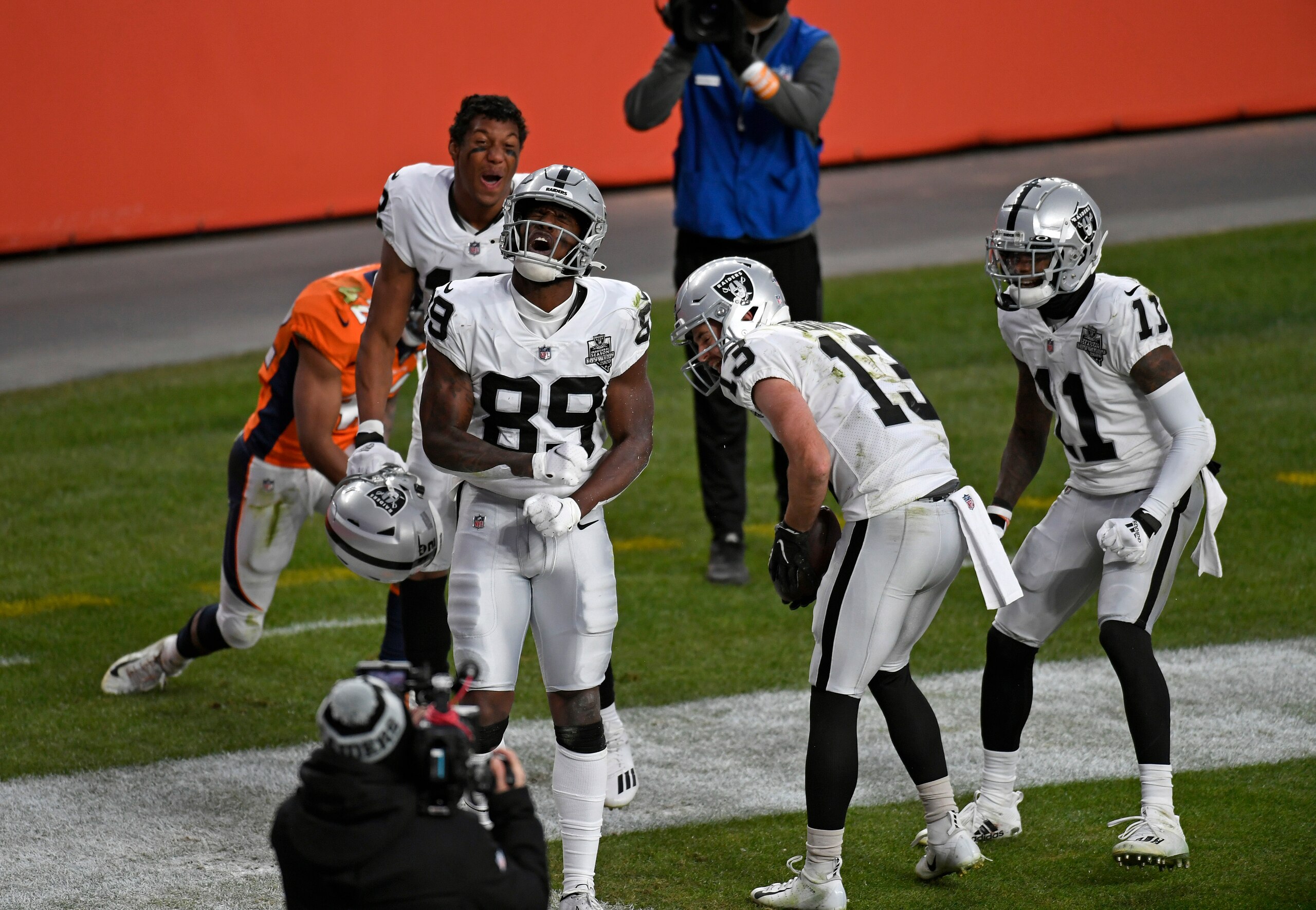 DENVER, COLORADO - JANUARY 3:  Las Vegas Raiders Bryan Edwards, #89, celebrates his second quarter touchdown with teammates and wide receivers Zay Jones, #12, second from left, Hunter Renfrow, #13, second from right, and Henry Ruggs III, #11, right, at Empower Field at Mile High as the Broncos take on the Las Vegas Raiders in their final game of the year on January 3, 2021 in Denver, Colorado. The Denver Broncos lost to the Las Vegas Raiders 32-31. (Photo by Helen H. Richardson/MediaNews Group/The Denver Post via Getty Images)