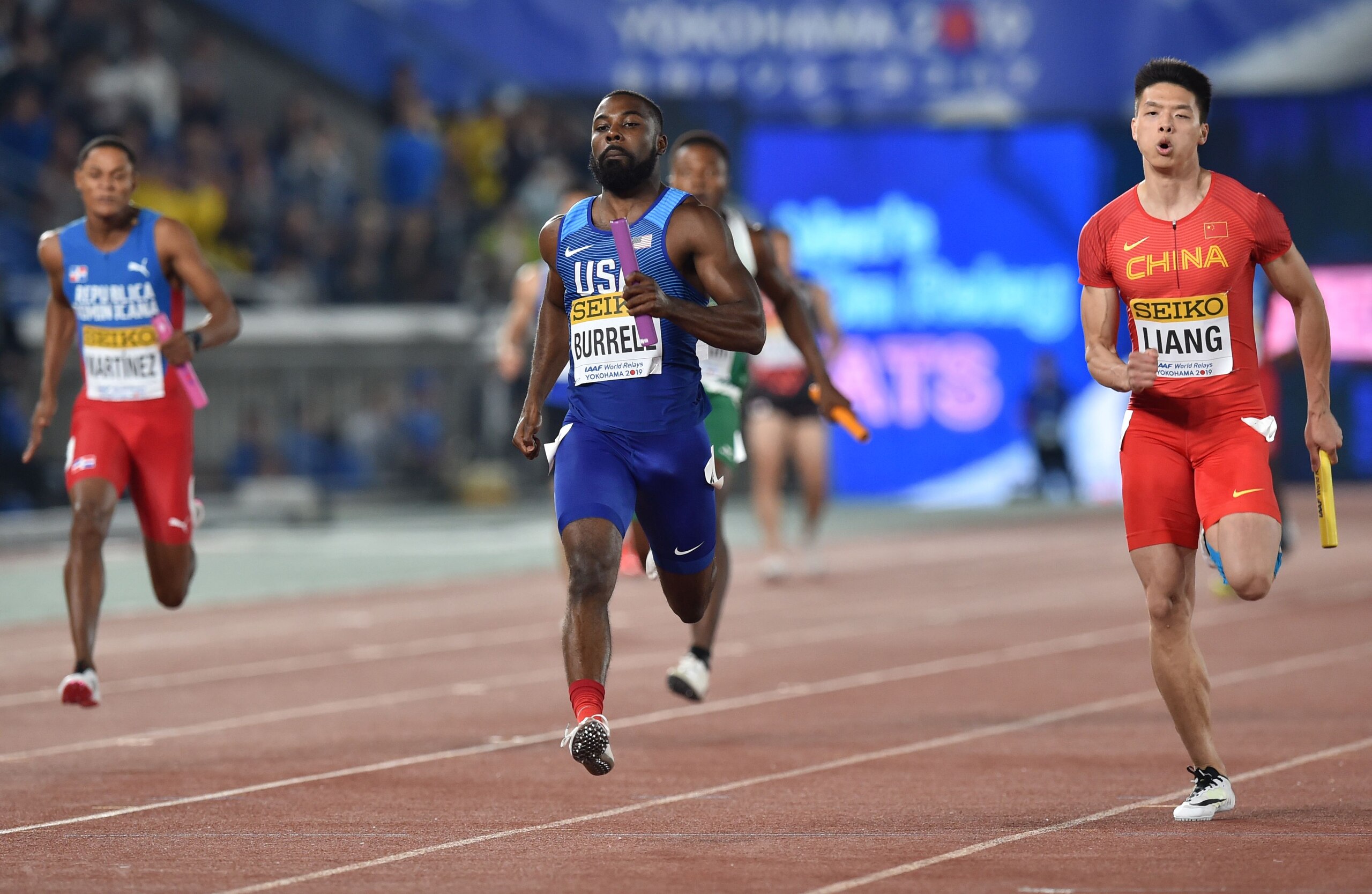 Cameron Burrell of the US (C) competes during a heat of the 4x100 metres relay at the IAAF World Relays athletics event at Nissan Stadium in Yokohama on May 11, 2019. (Photo by Kazuhiro NOGI / AFP) (Photo by KAZUHIRO NOGI/AFP via Getty Images)