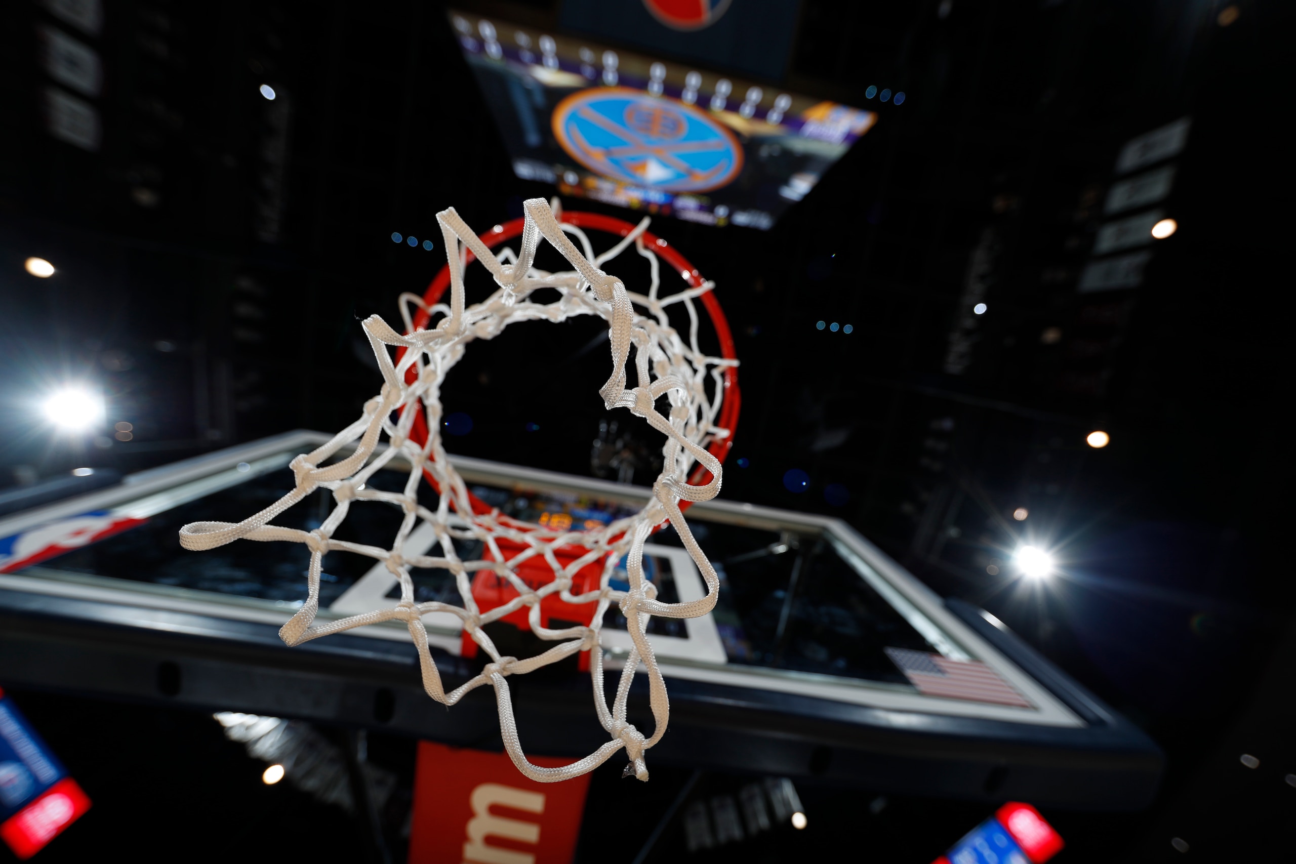 The webbing of the net before the Denver Nuggets host the Sacramento Kings in the first half of an NBA basketball game Tuesday, Jan. 3,  in Denver. (AP Photo/David Zalubowski)