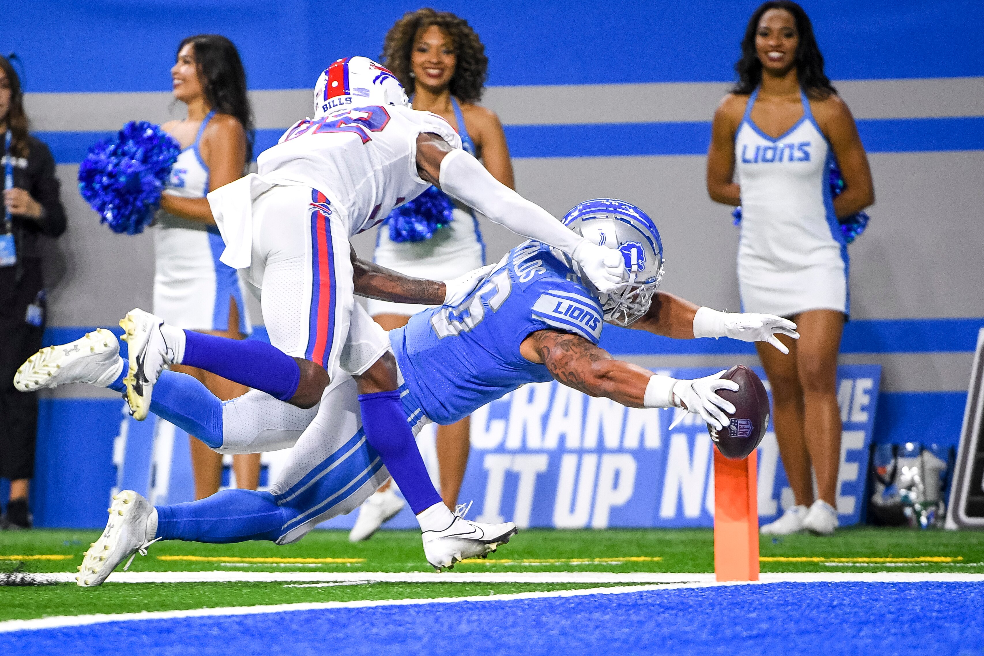 DETROIT, MICHIGAN - AUGUST 13: Rachad Wildgoose #32 of the Buffalo Bills tackles Craig Reynolds #46 of the Detroit Lions into the end zone during the fourth quarter of a preseason game at Ford Field on August 13, 2021 in Detroit, Michigan. (Photo by Nic Antaya/Getty Images)