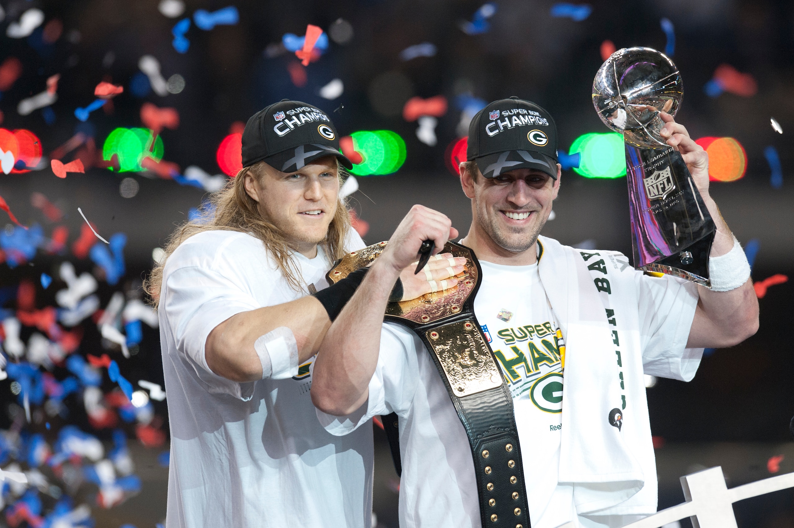 ARLINGTON,TX - FEBRUARY 06: Aaron Rodgers #12 of the Green Bay Packers holds up the Vince Lombardi Trophy as Clay Matthews #52 looks on after defeating the  Pittsburgh Steelers in Super Bowl XLV on February 6, 2011 at Cowboys Stadium in Arlington, Texas. The  Packers defeated the Steelers 31 to 25.  (Photo by Rob Tringali/SportsChrome/Getty Images)
