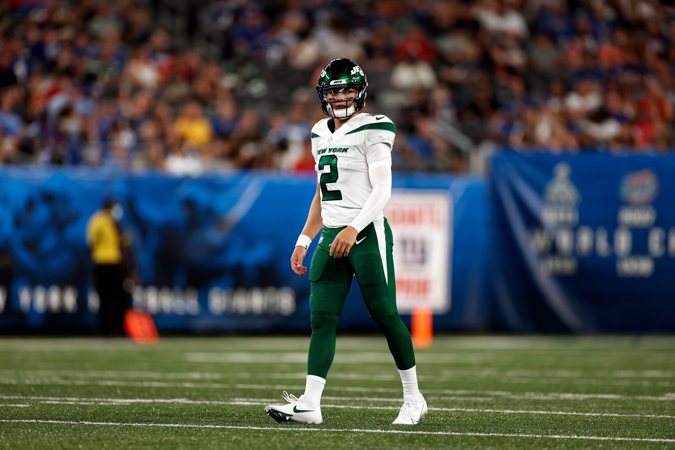New York Jets quarterback Zach Wilson (2) walks off the field against the New York Giants during a preseason NFL football game, Saturday, Aug. 14, 2021, in East Rutherford, N.J. (AP Photo/Adam Hunger)