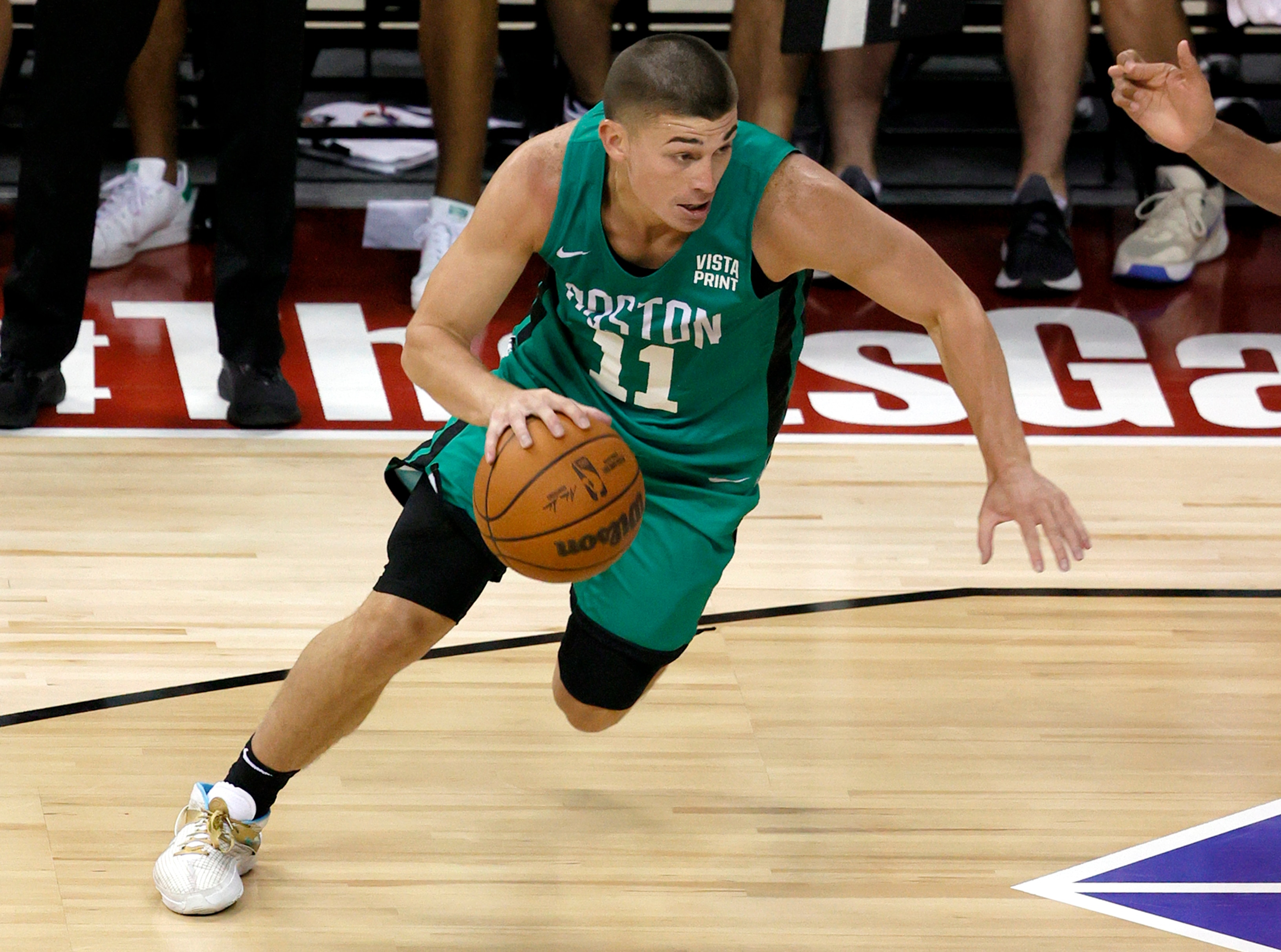 LAS VEGAS, NEVADA - AUGUST 10:  Payton Pritchard #11 of the Boston Celtics drives against the Denver Nuggets during the 2021 NBA Summer League at the Thomas & Mack Center on August 10, 2021 in Las Vegas, Nevada. The Celtics defeated the Nuggets 107-82. NOTE TO USER: User expressly acknowledges and agrees that, by downloading and or using this photograph, User is consenting to the terms and conditions of the Getty Images License Agreement. (Photo by Ethan Miller/Getty Images)