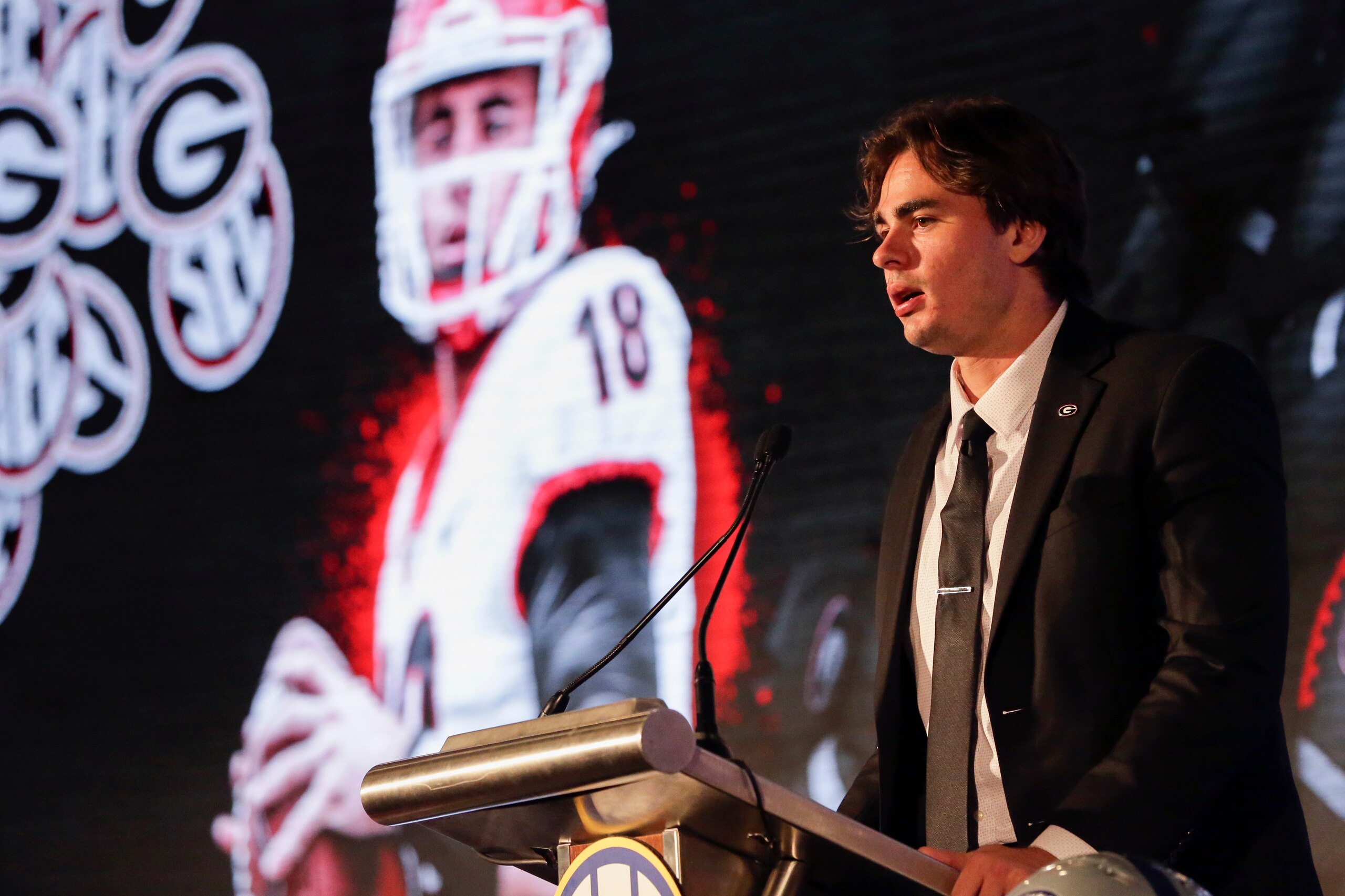 Georgia's JT Daniels speaks to reporters during the NCAA college football Southeastern Conference Media Days Tuesday, July 20, 2021, in Hoover, Ala. (AP Photo/Butch Dill)