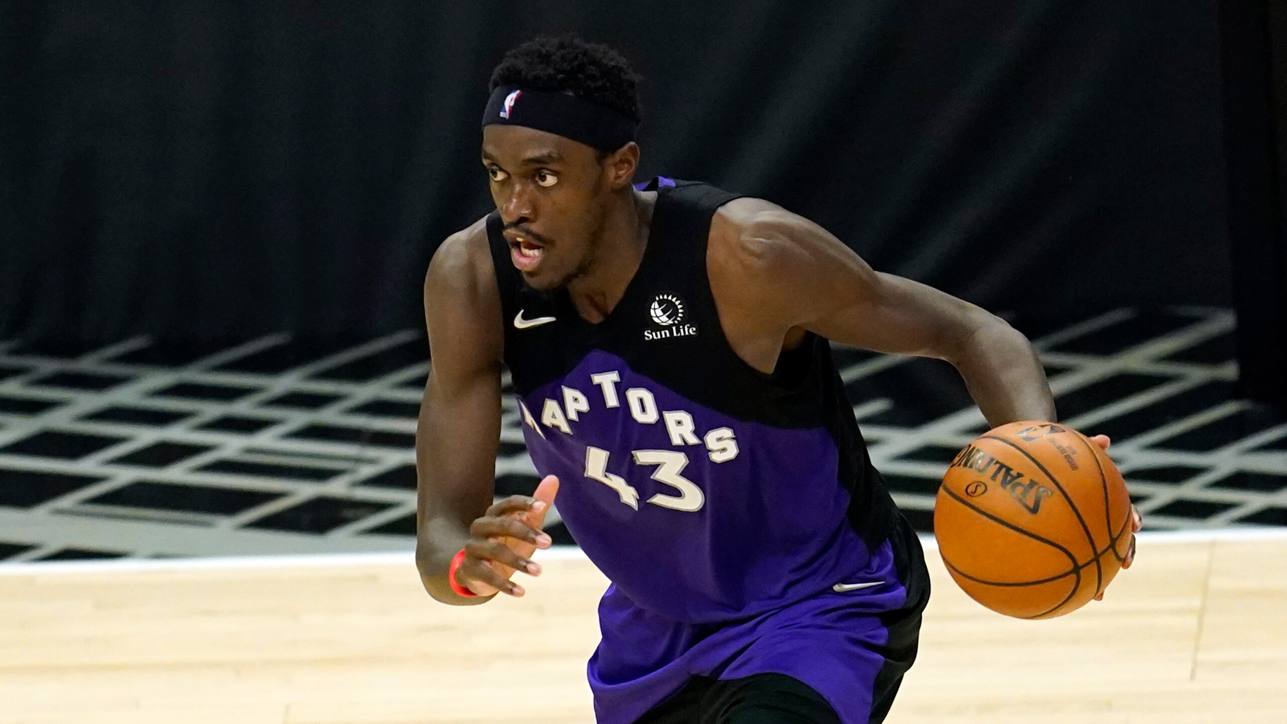 Toronto Raptors forward Pascal Siakam dribbles during an NBA basketball game against the Los Angeles Clippers Tuesday, May 4, 2021 in Los Angeles. (AP Photo/Marcio Jose Sanchez)
