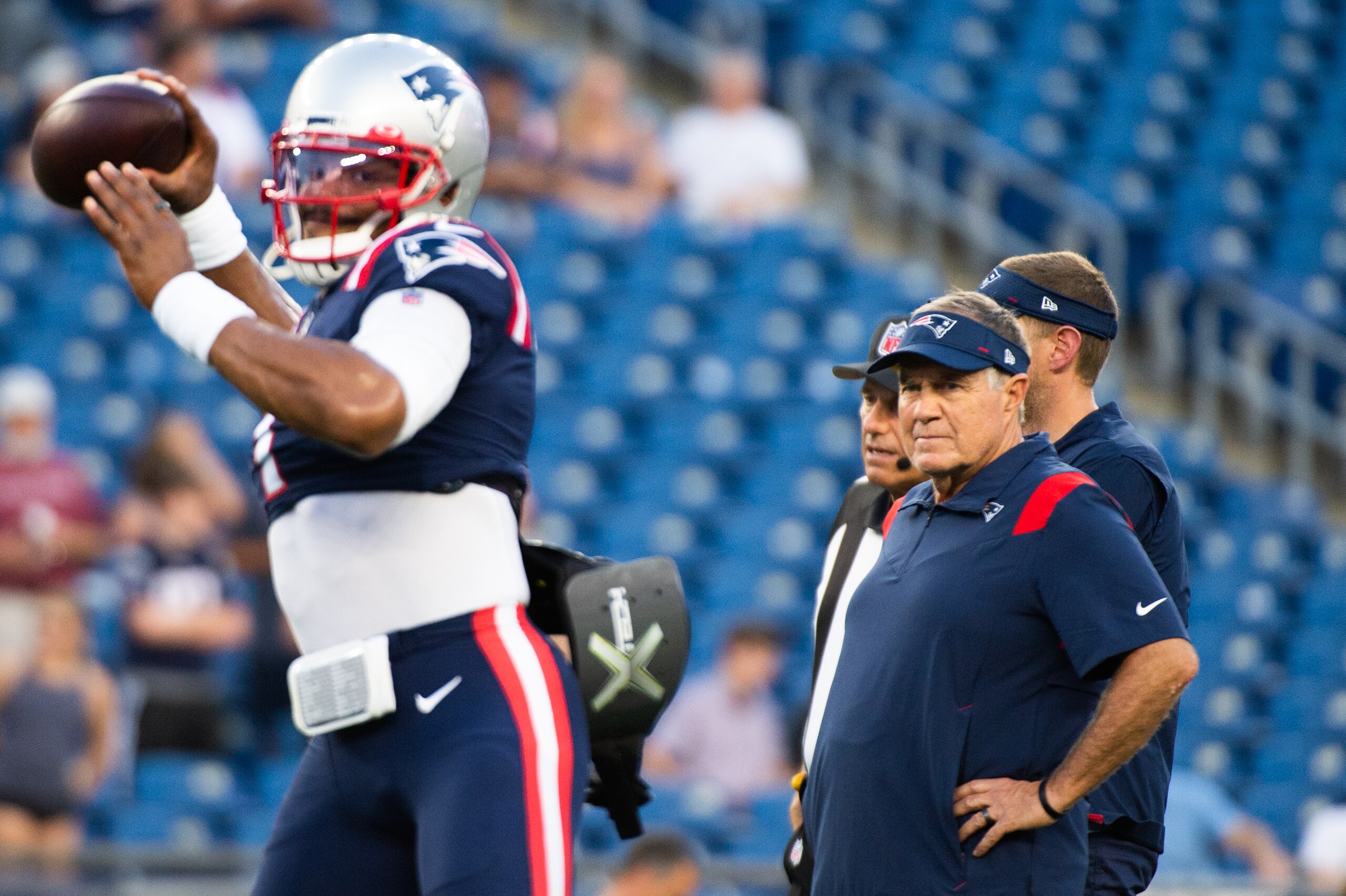 FOXBOROUGH, MA - AUGUST 12: New England Patriots head coach Bill Belichick watches Cam Newton #1 during warm ups prior to the start of the game against the Washington Football Team at Gillette Stadium on  August 12, 2021 in Foxborough, Massachusetts. (Photo by Kathryn Riley/Getty Images)