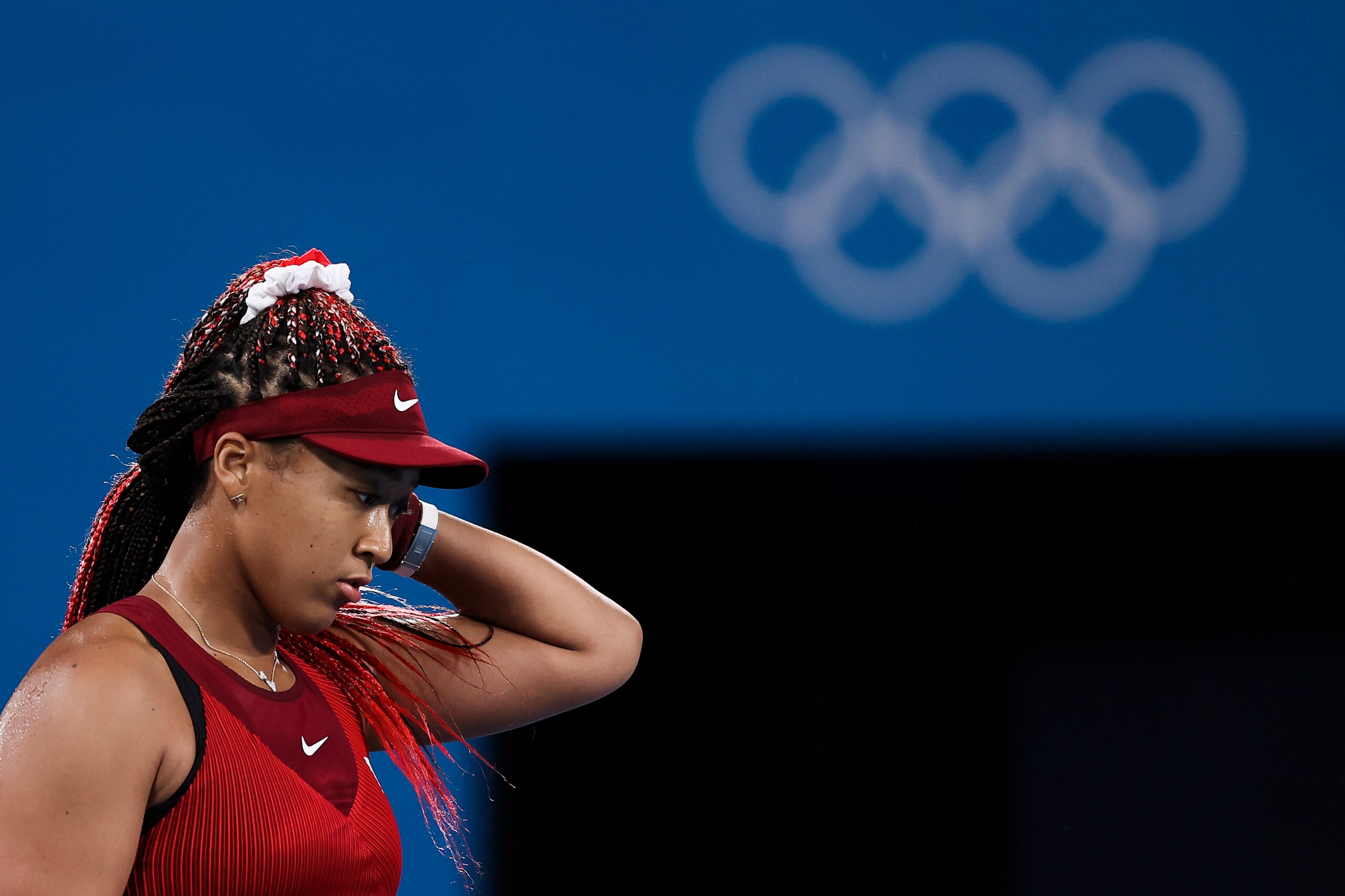 TOKYO, JAPAN - JULY 27: Naomi Osaka of Team Japan reacts after a point during her Women's Singles Third Round match against Marketa Vondrousova of Team Czech Republic on day four of the Tokyo 2020 Olympic Games at Ariake Tennis Park on July 27, 2021 in Tokyo, Japan. (Photo by David Ramos/Getty Images) TOKYO, JAPAN - JULY 27: Naomi Osaka of Team Japan reacts after a point during her Women's Singles Third Round match against Marketa Vondrousova of Team Czech Republic on day four of the Tokyo 2020 Olympic Games at Ariake Tennis Park on July 27, 2021 in Tokyo, Japan. (Photo by David Ramos/Getty Images)